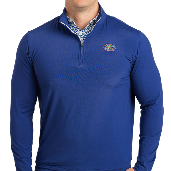 Blue long-sleeve shirt with a logo on a white background