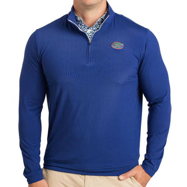 Blue long-sleeve shirt with a logo on a white background