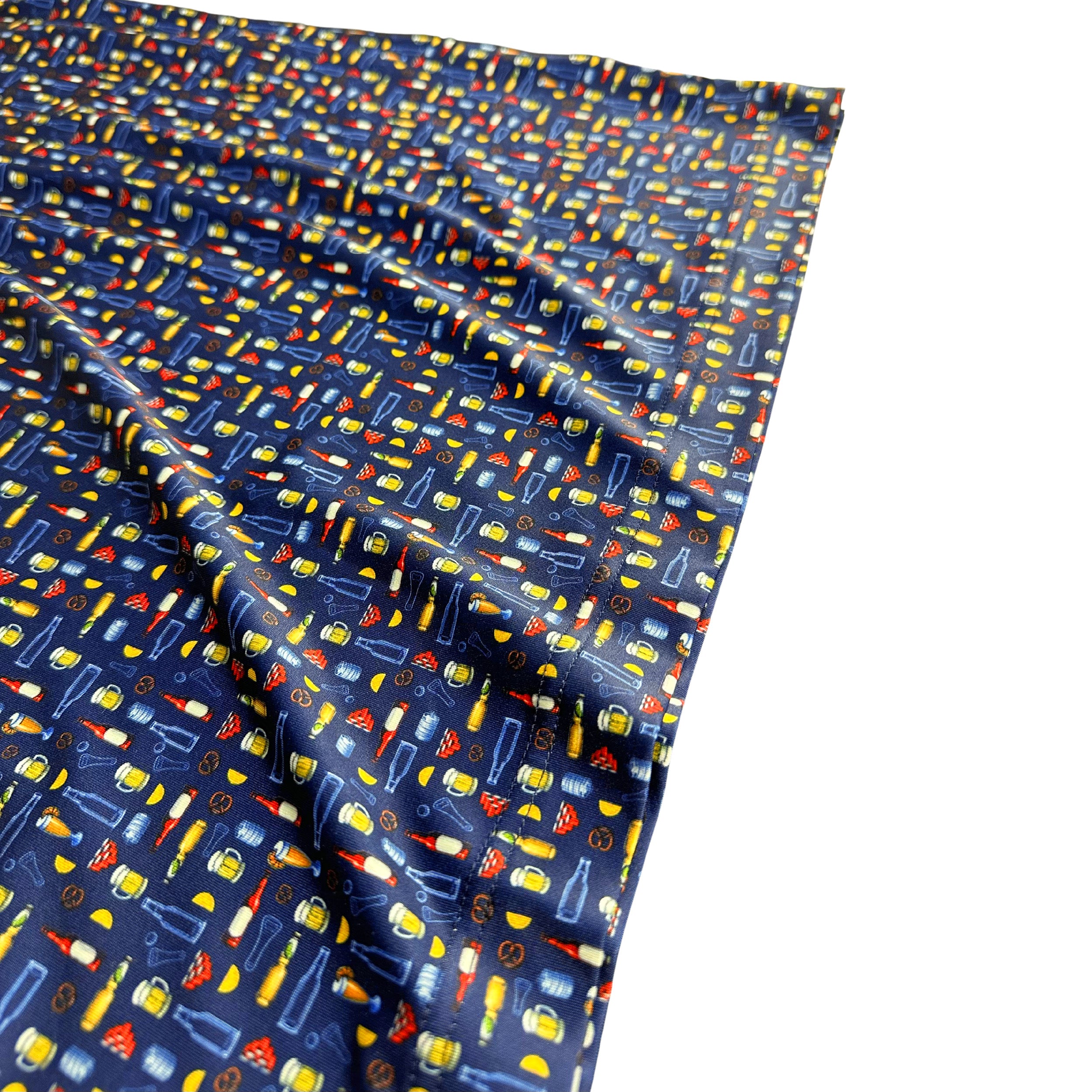 Patterned fabric with colorful icons on a blue background
