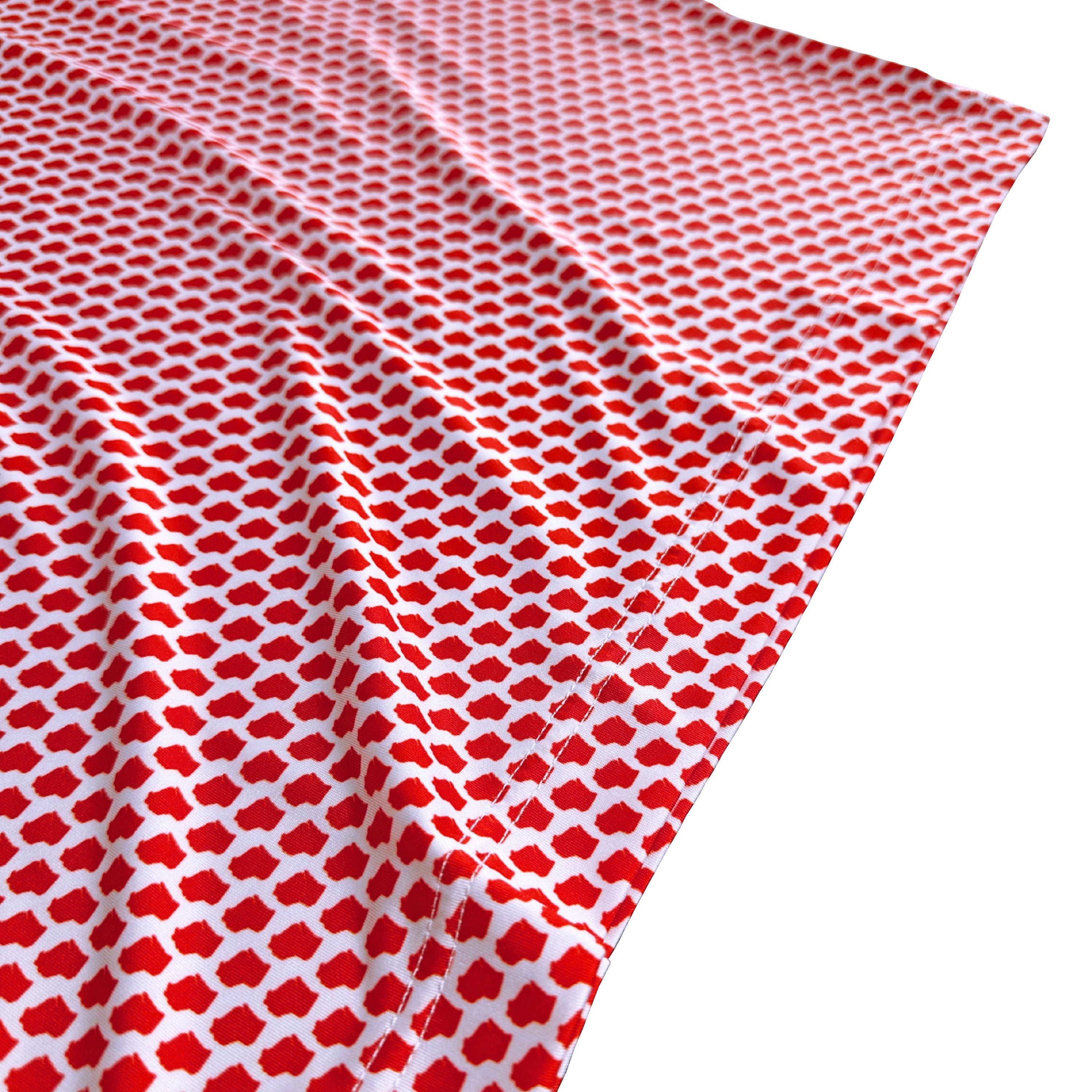Red and white patterned fabric on a white background