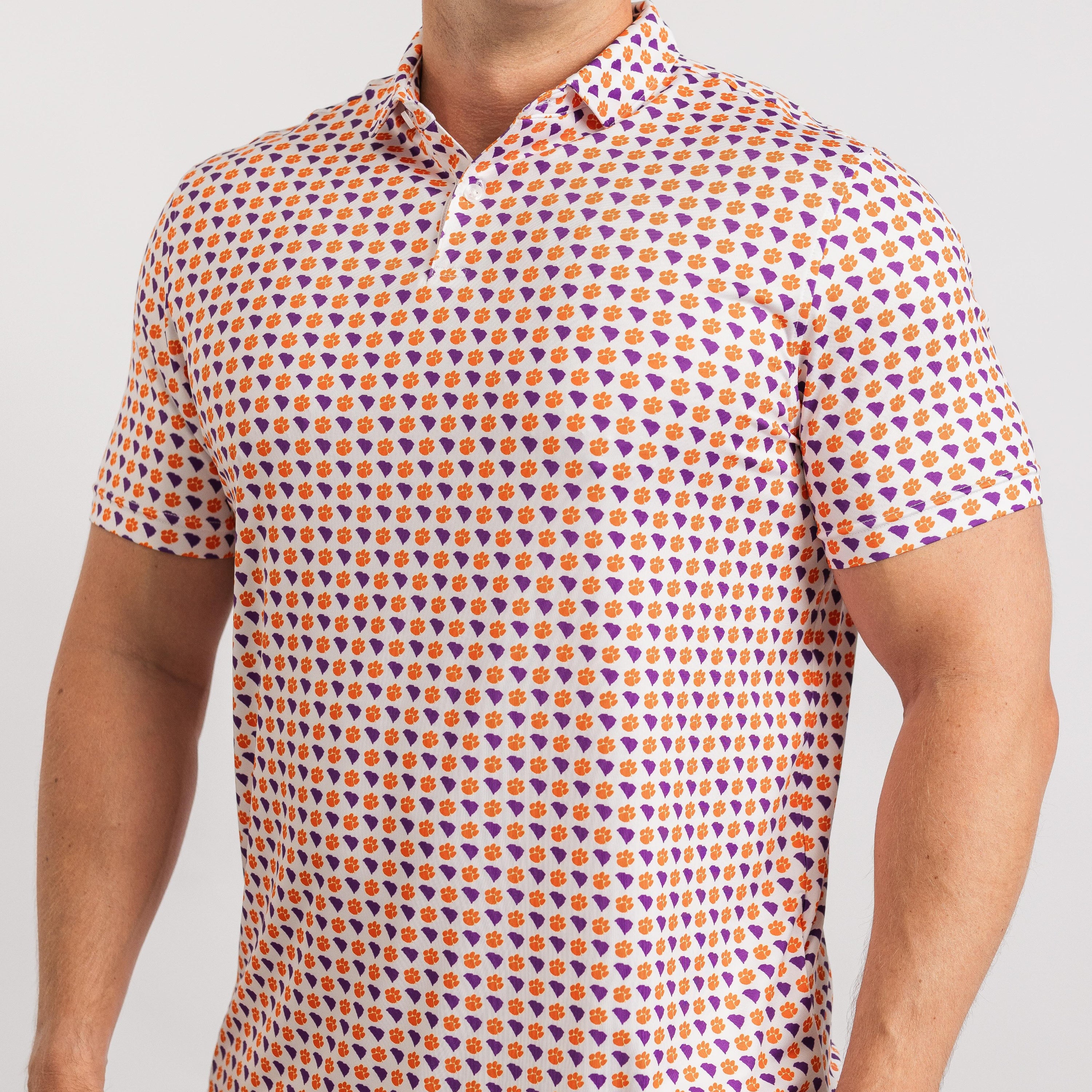 Man wearing a patterned shirt with geometric design on a plain background