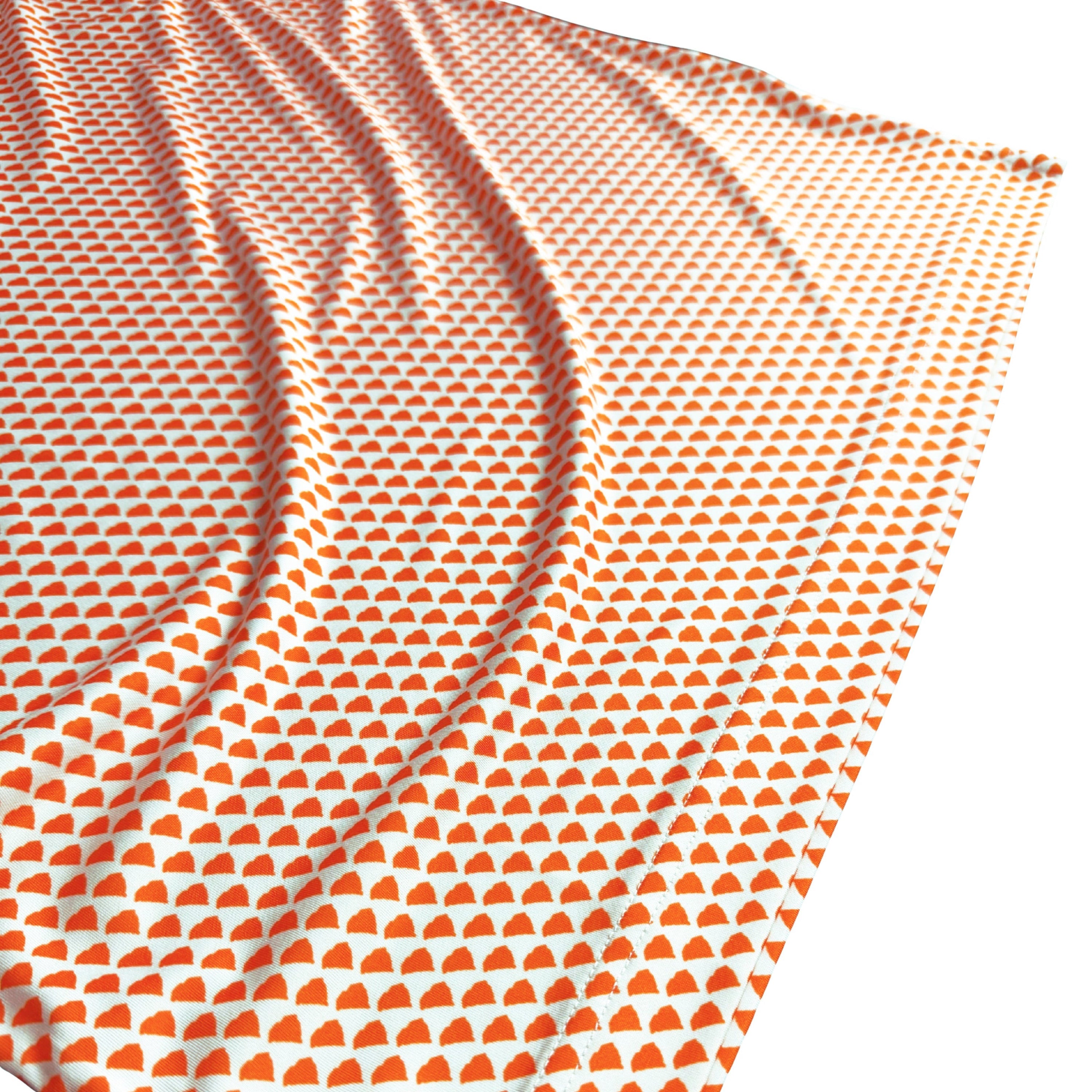 Fabric with orange geometric pattern on white background