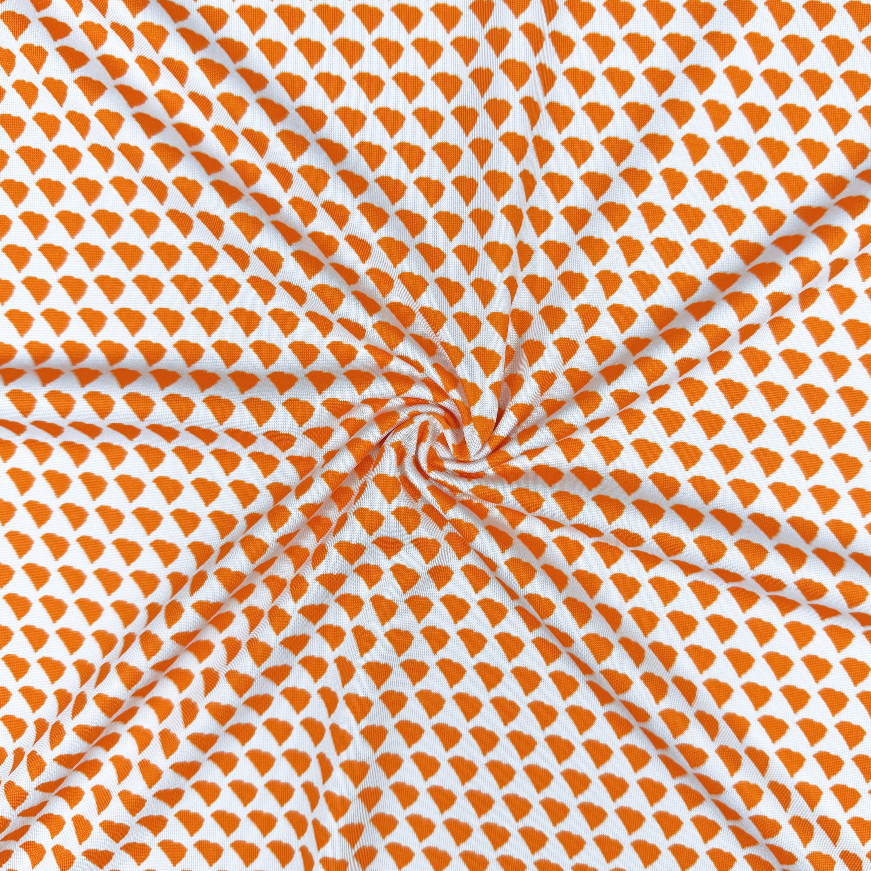 Fabric with orange and white geometric pattern