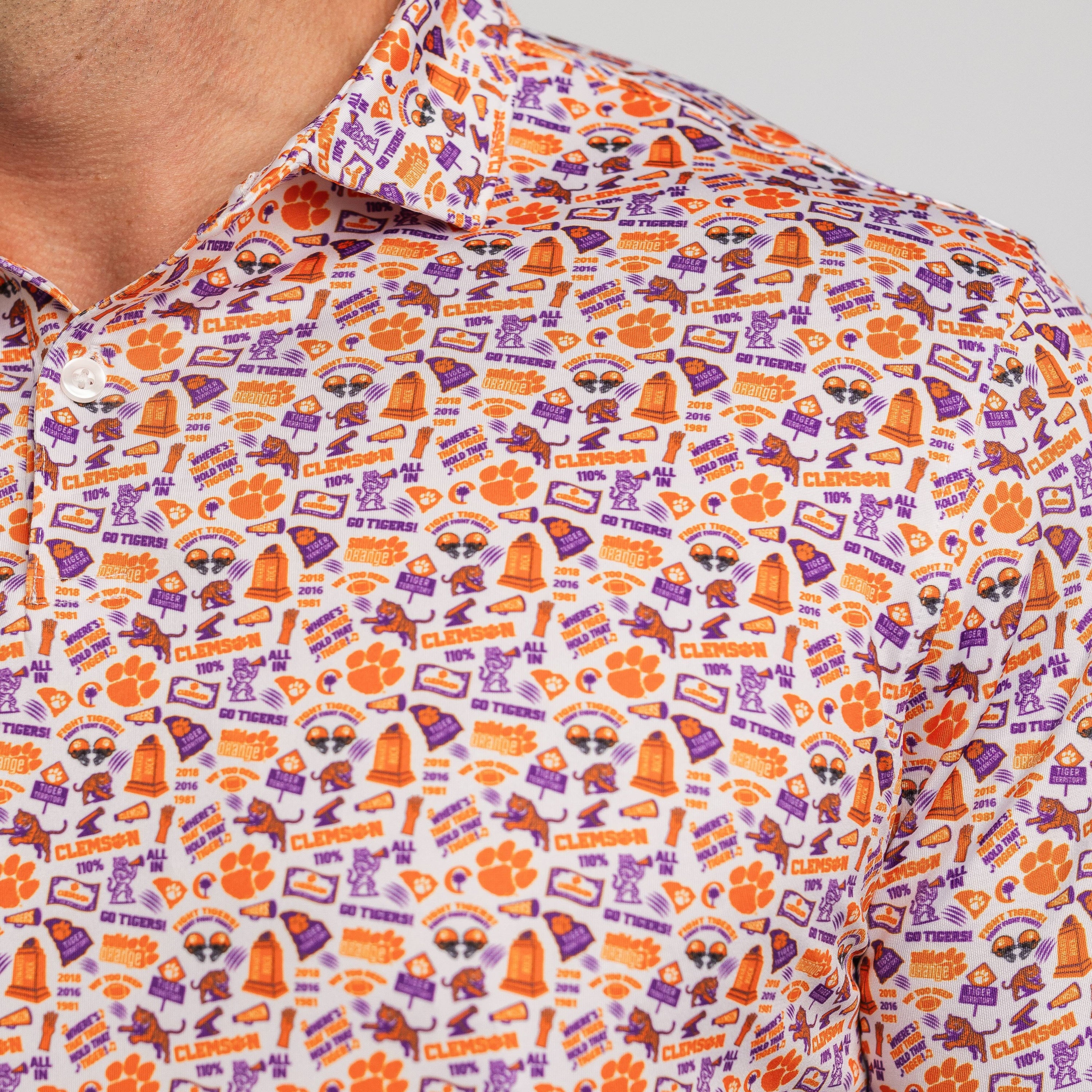 Close-up of a patterned shirt with orange and purple design on a white background