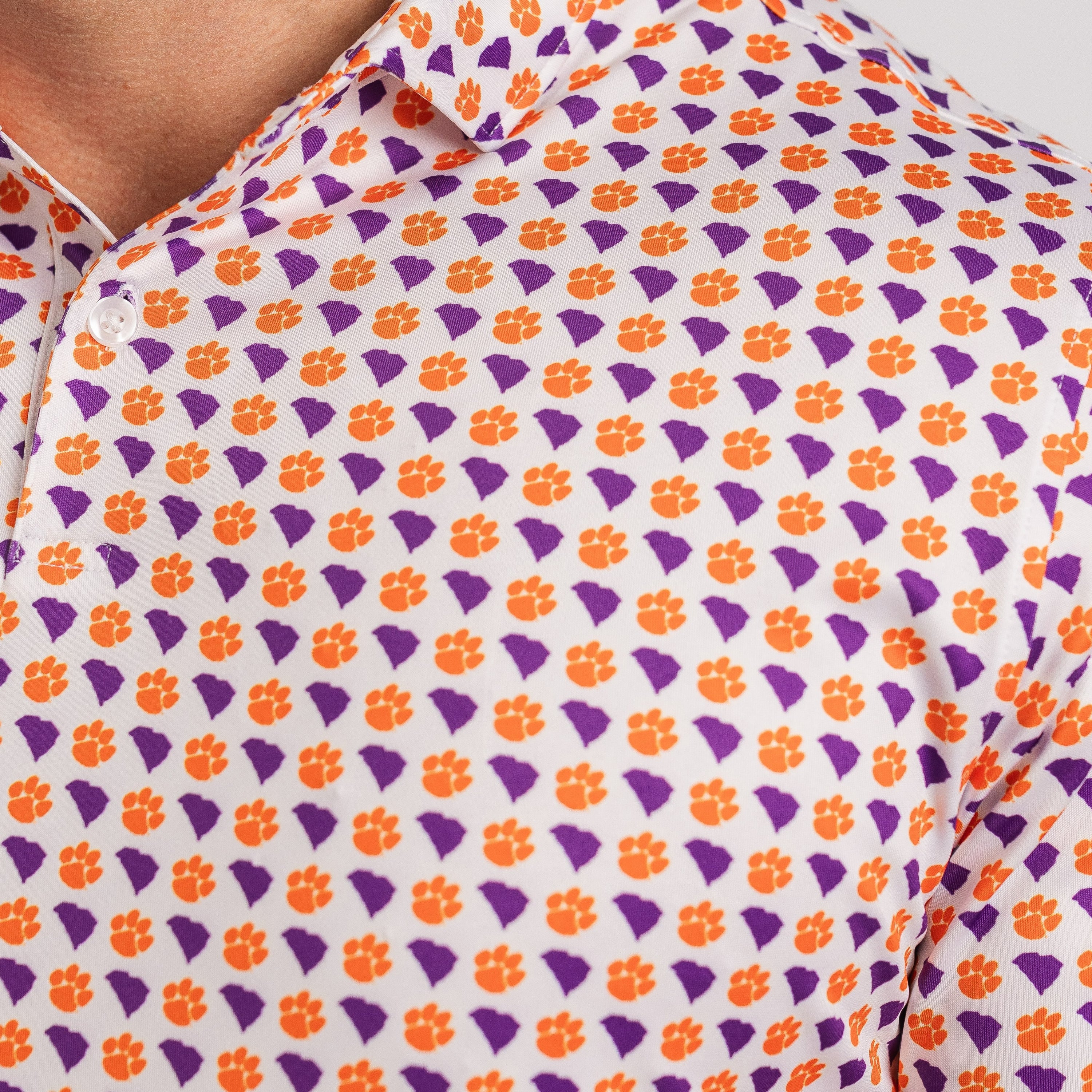 Close-up of a shirt with orange and purple geometric pattern