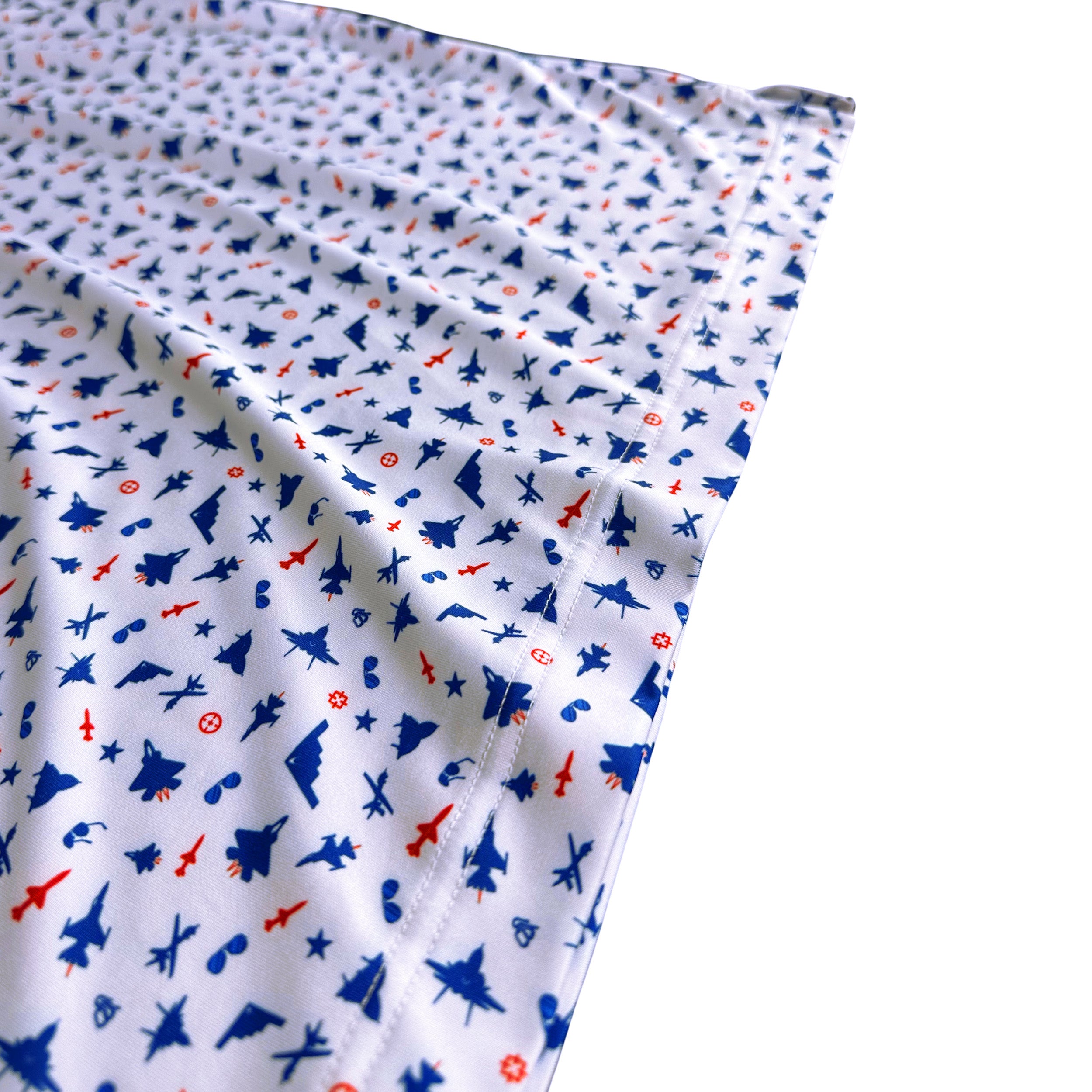 Folded fabric with airplane pattern on a white background