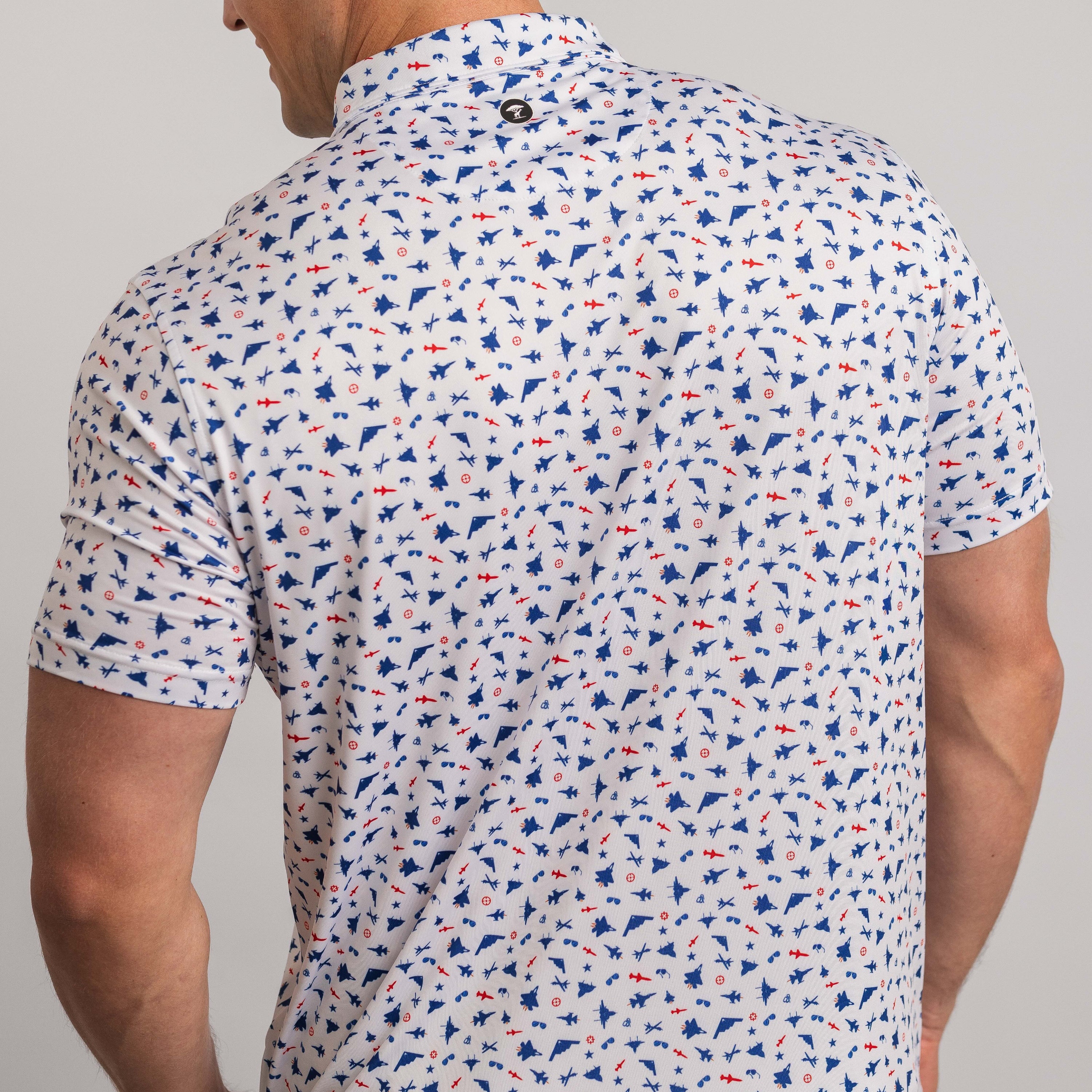Man wearing a patterned short-sleeve shirt with a neutral background