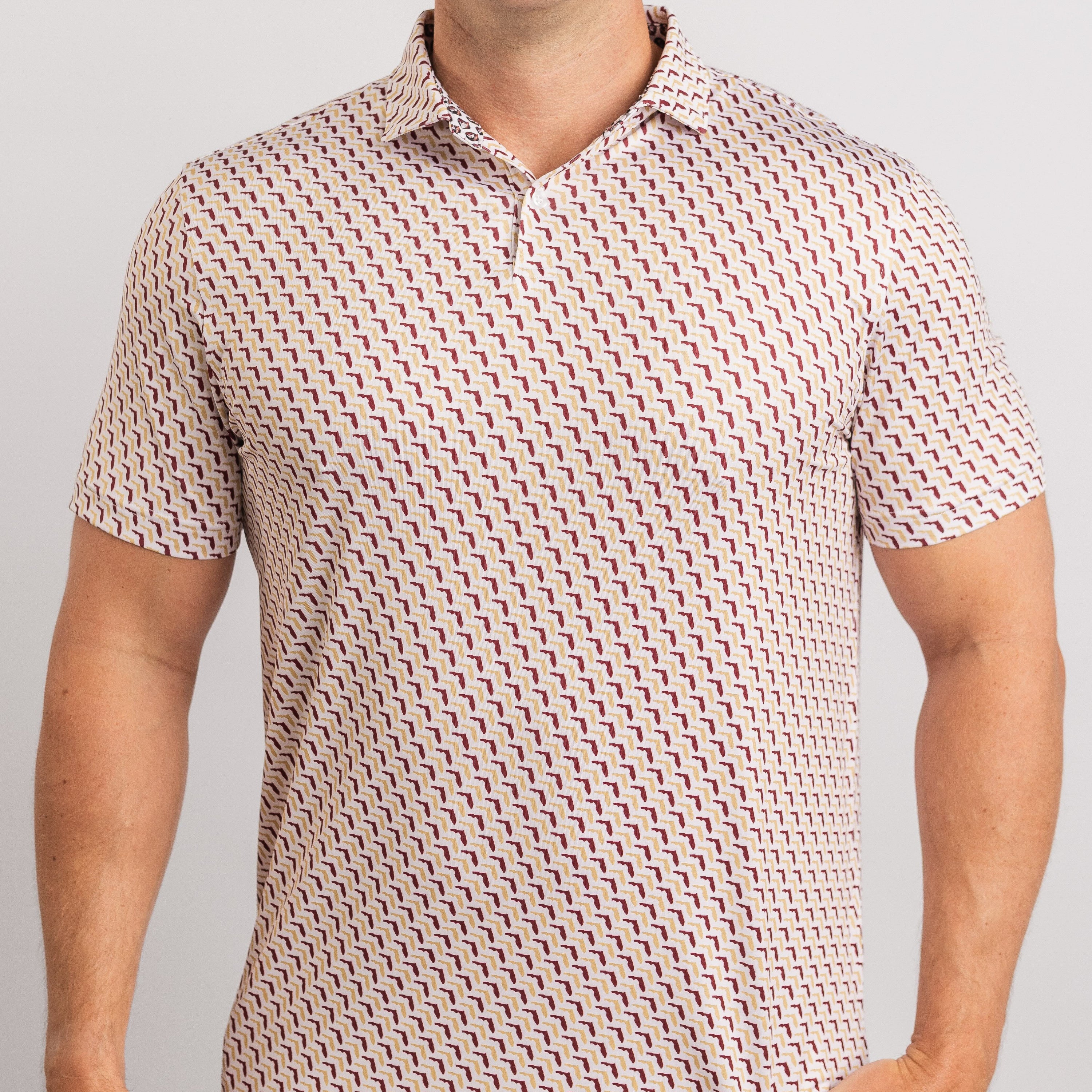 Man wearing a patterned polo shirt against a plain background