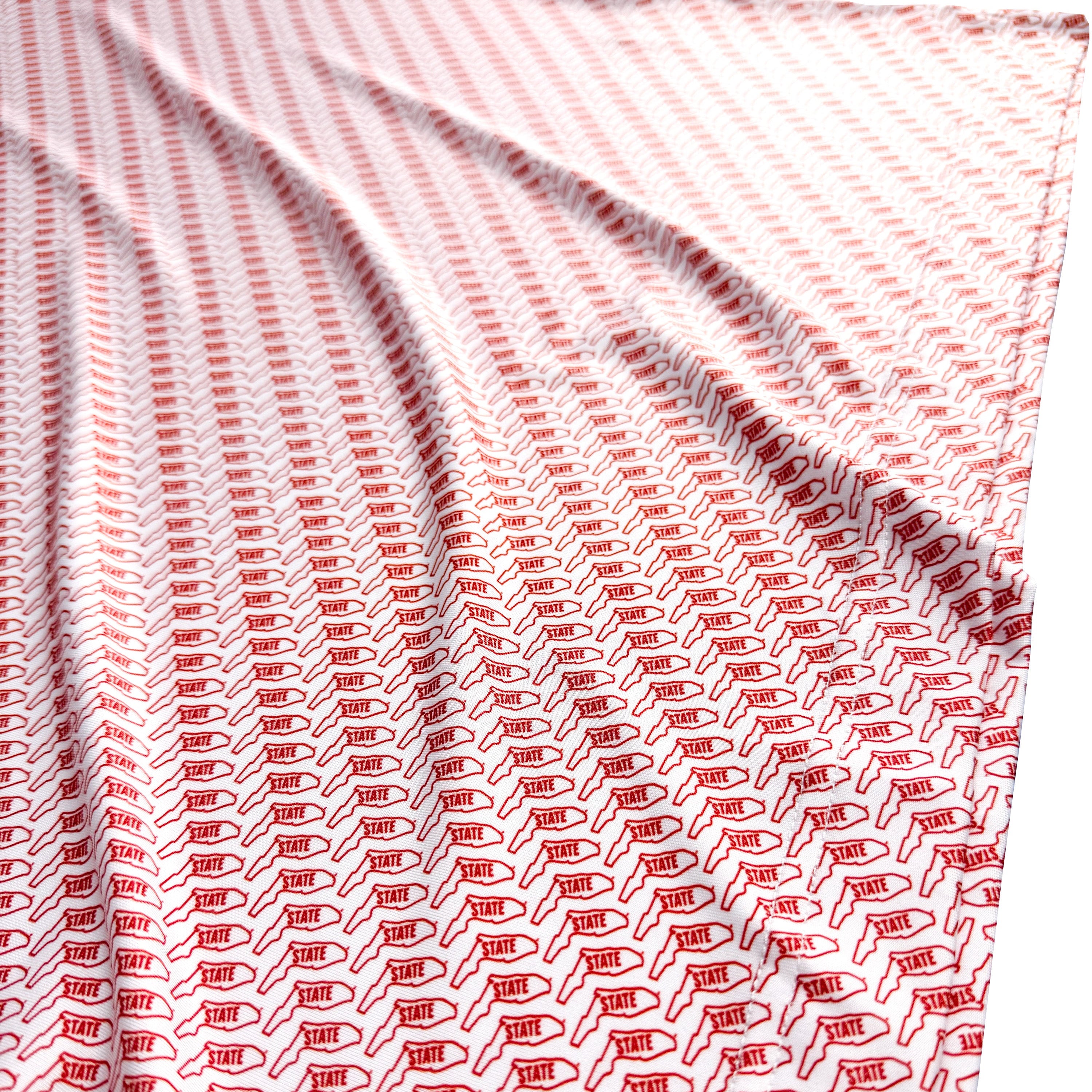 Red and white patterned fabric with a visible brand logo.