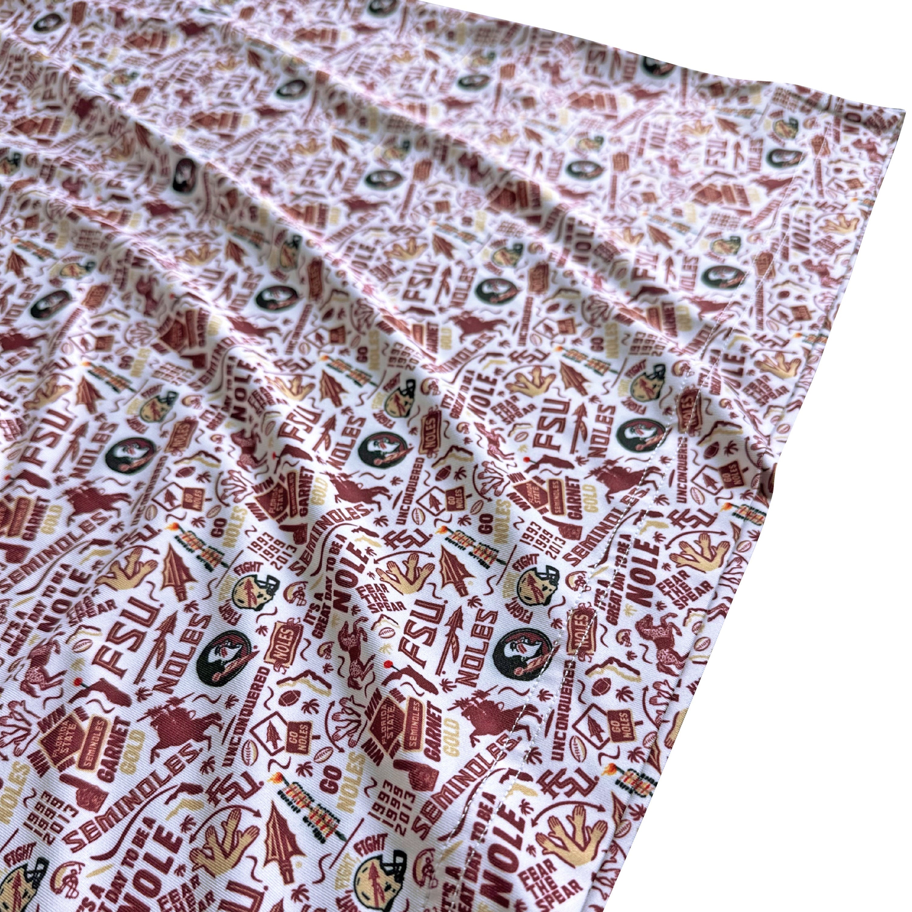 Fabric with repeated pattern of logos and text on a white background