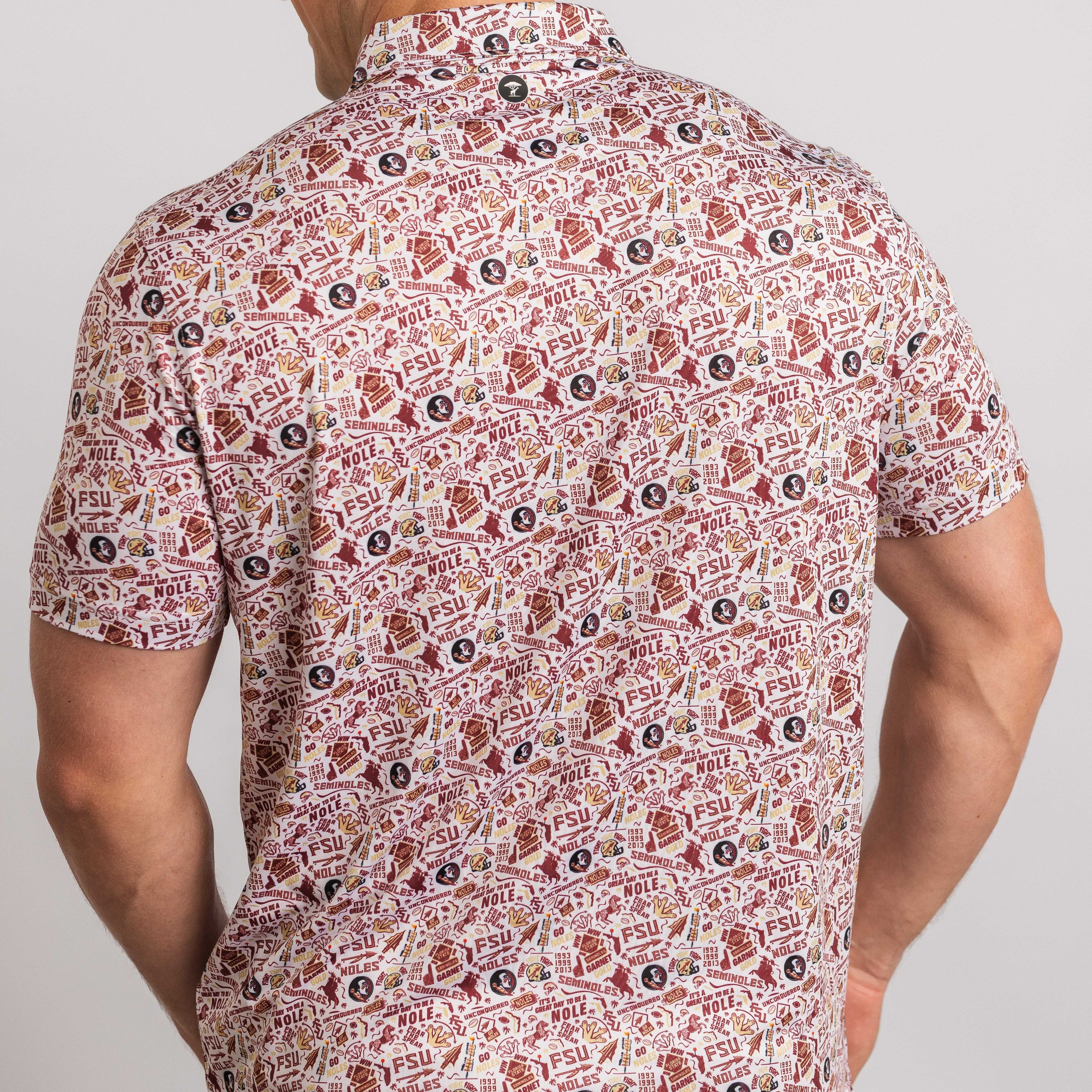 Man wearing a patterned shirt with a neutral background