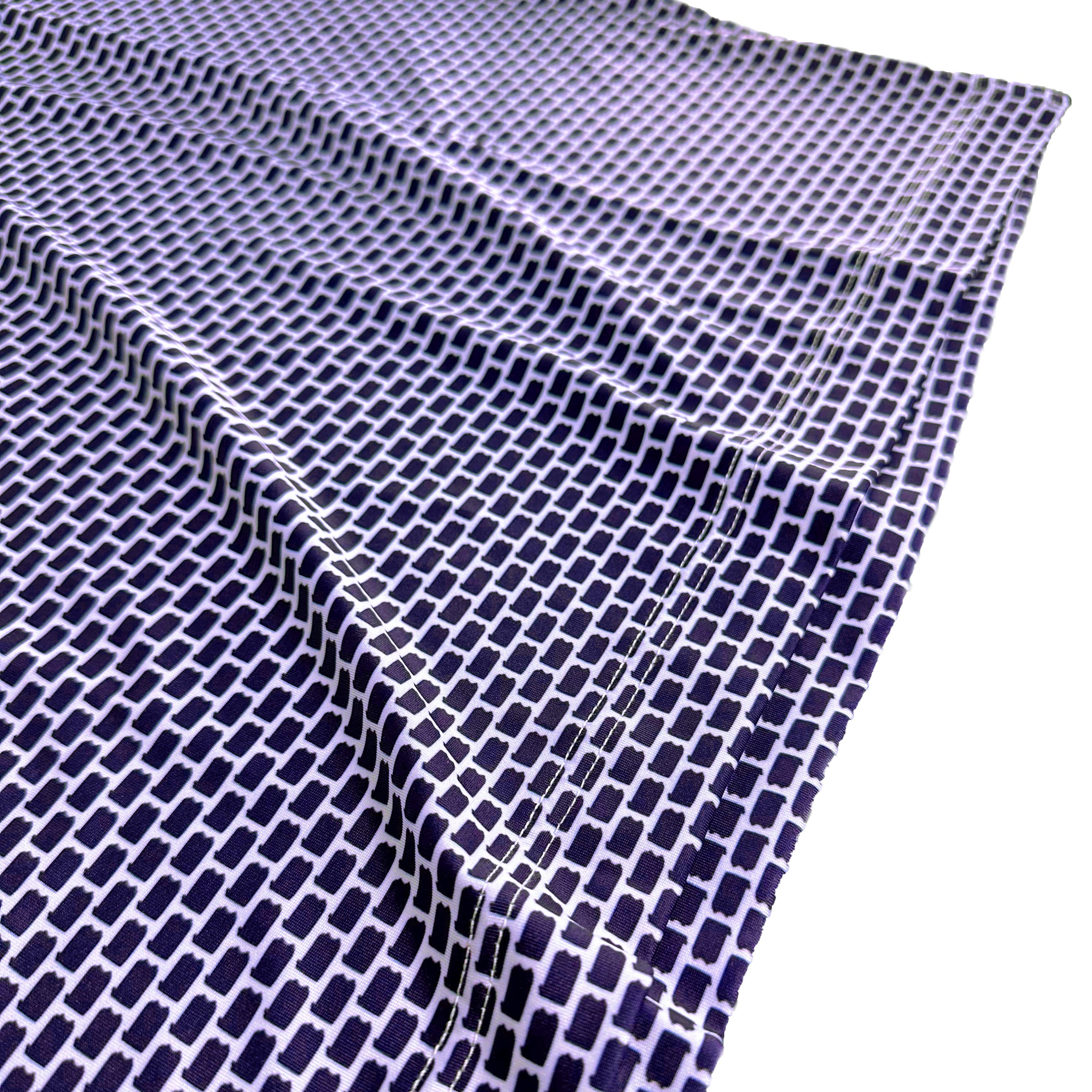 Navy blue and white checkered fabric on a white background