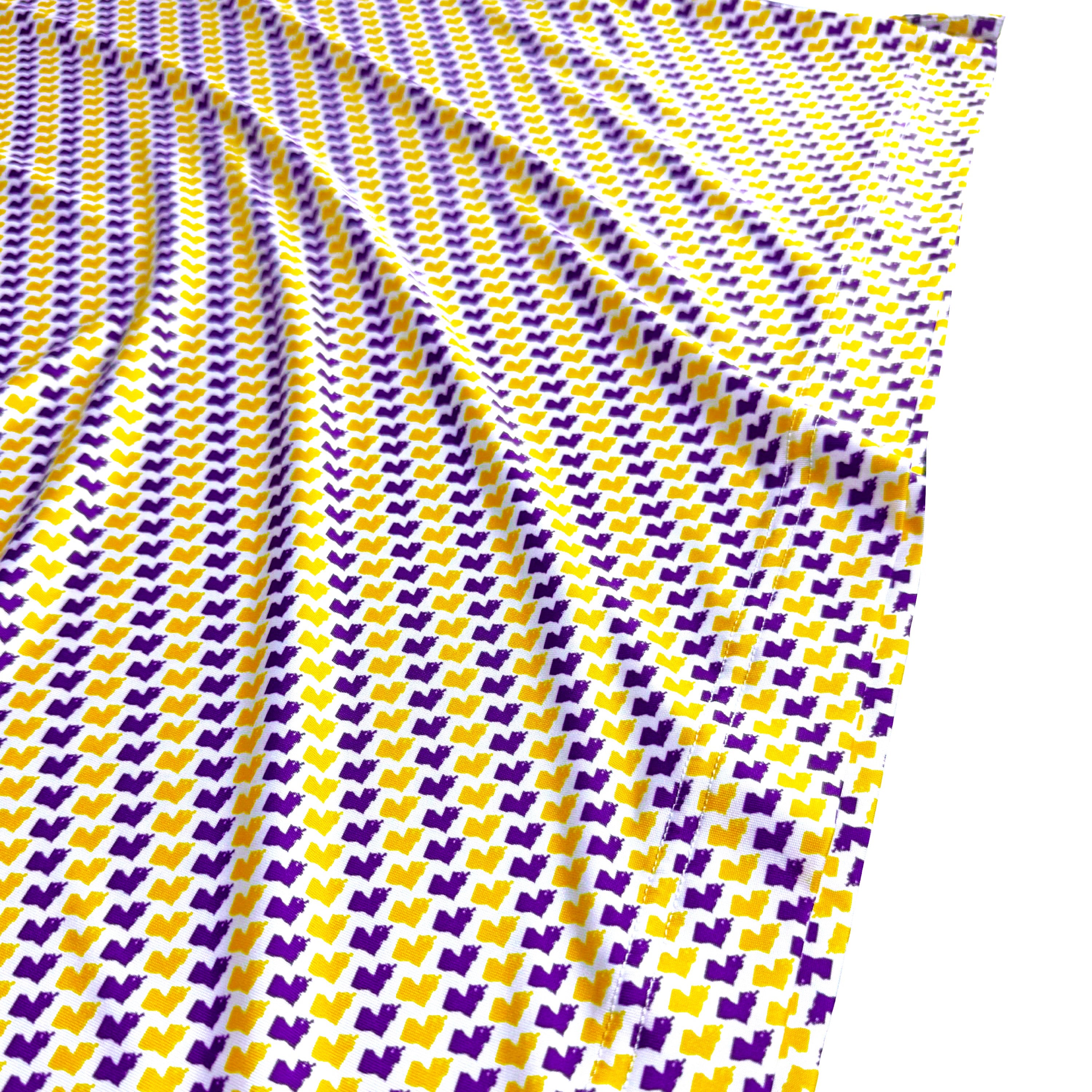 Fabric with purple and yellow pattern on a white background