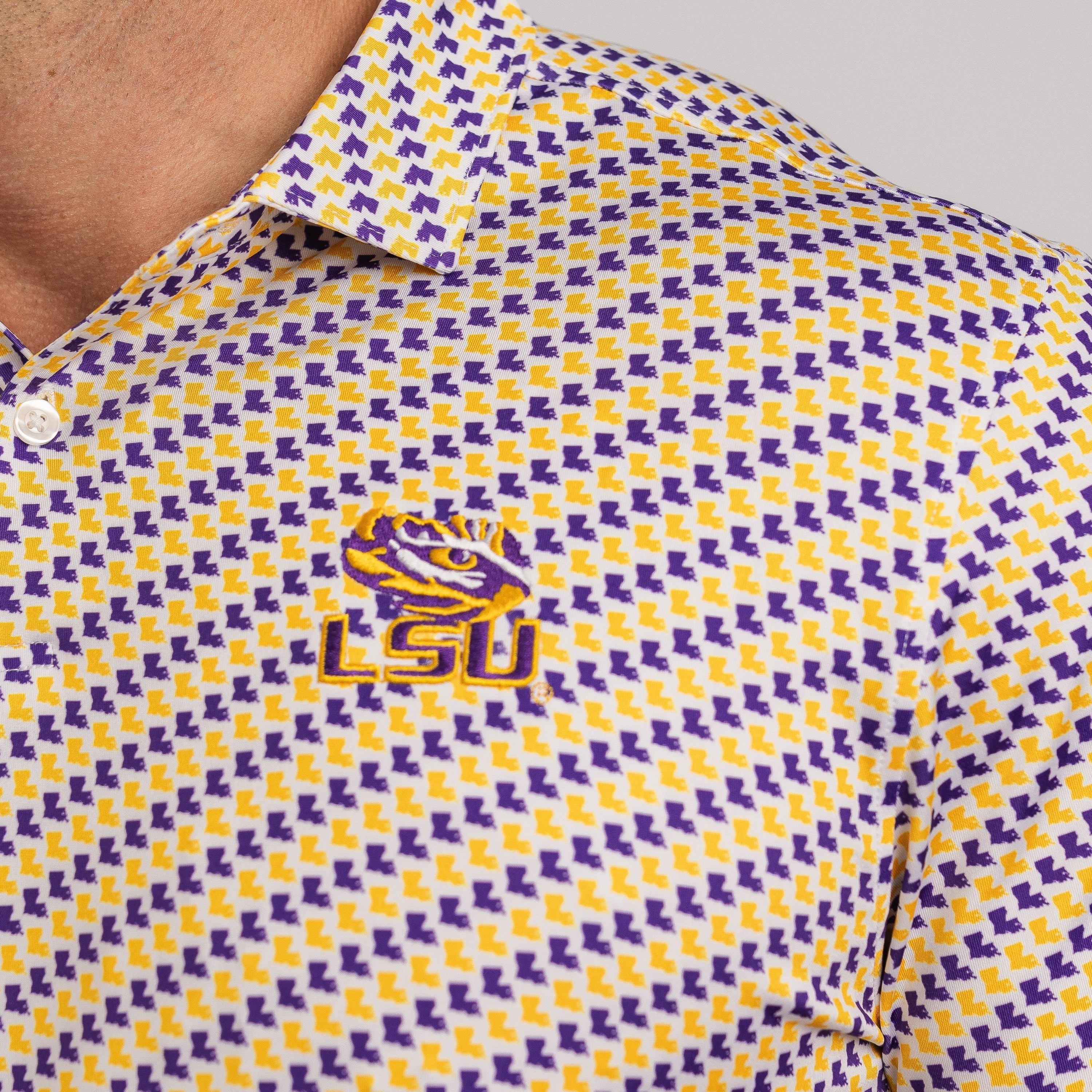 LSU patterned polo shirt with logo on a gray background