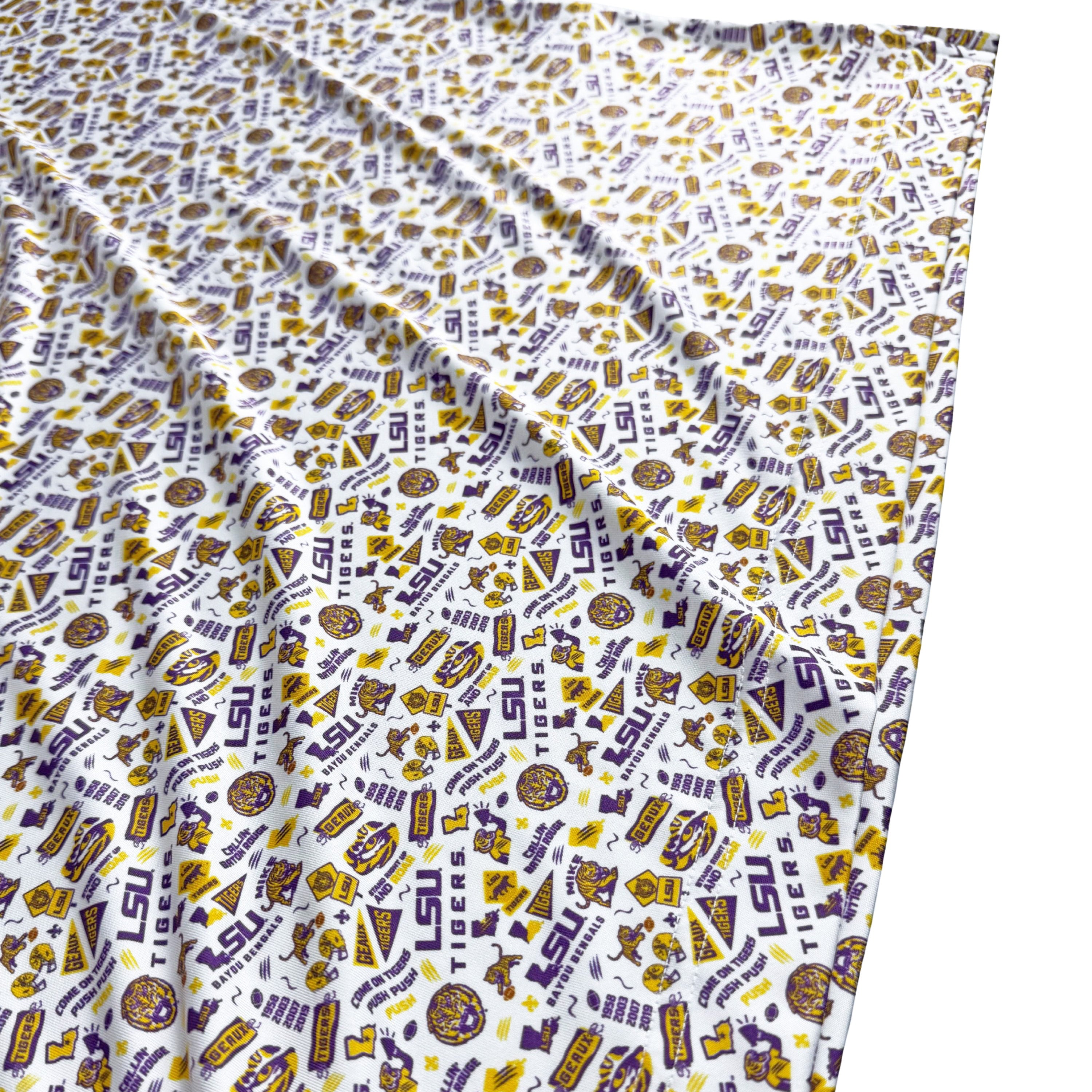 Fabric with LSU-themed pattern on a white background