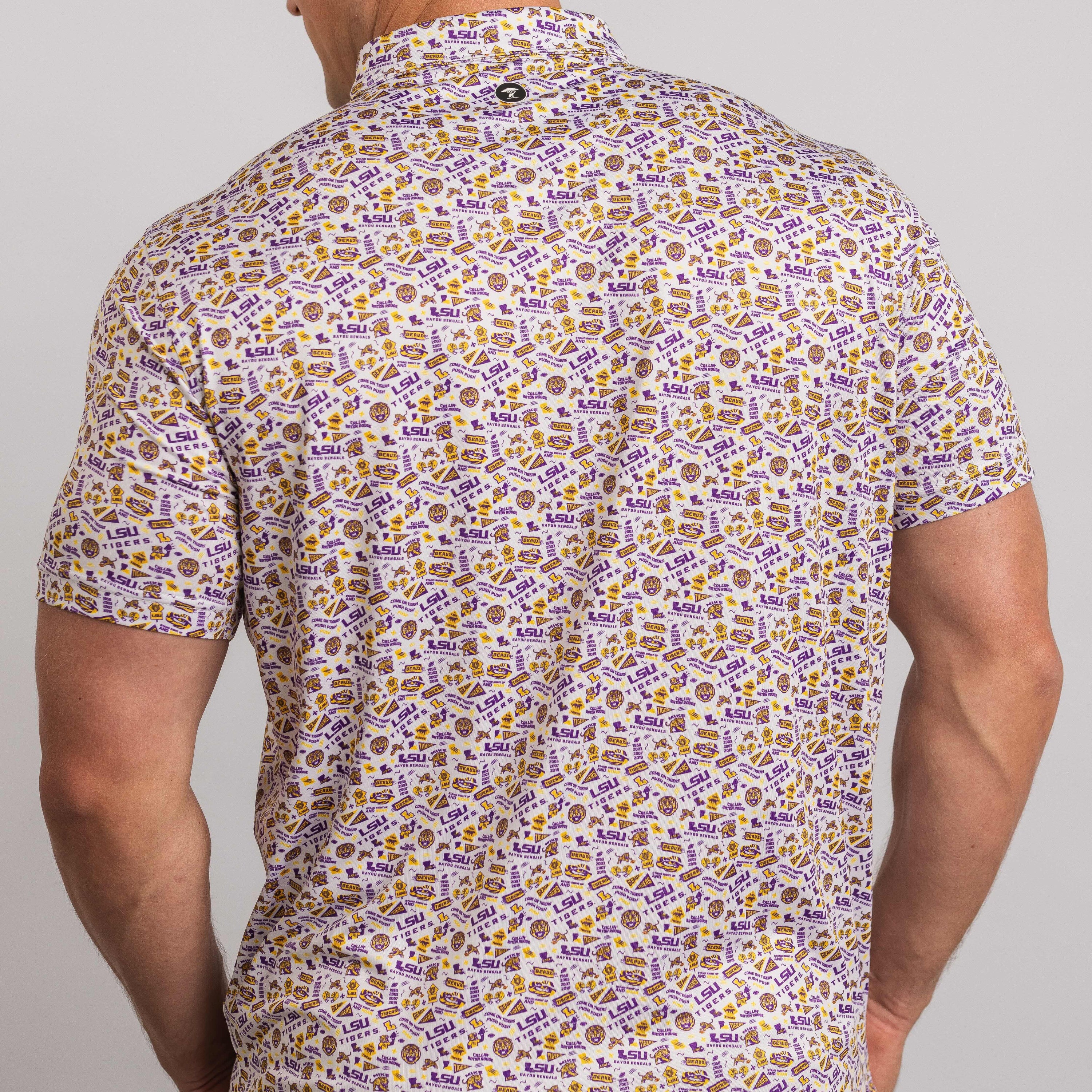 Man wearing a patterned shirt with a neutral background
