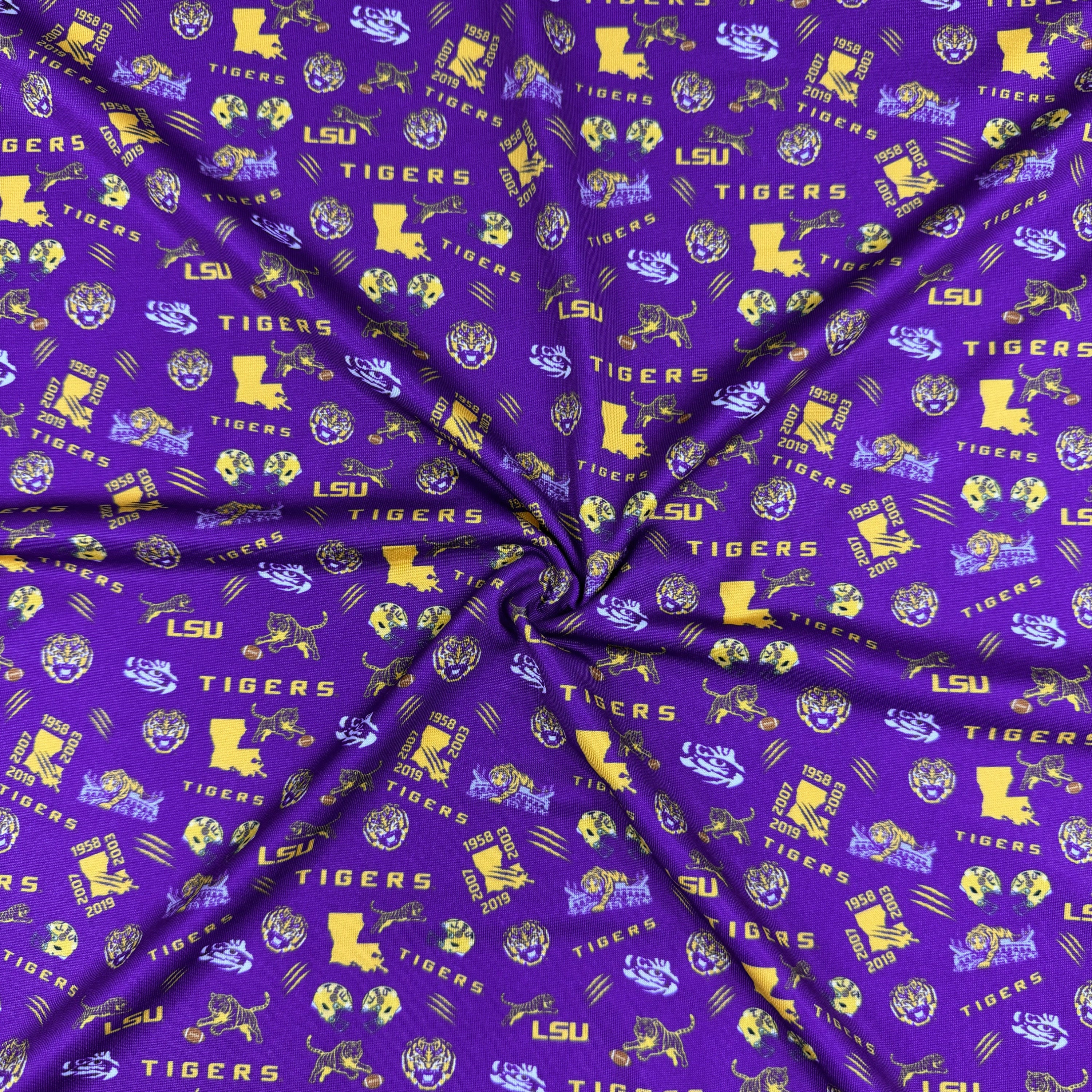 Purple fabric with LSU Tigers logos and text
