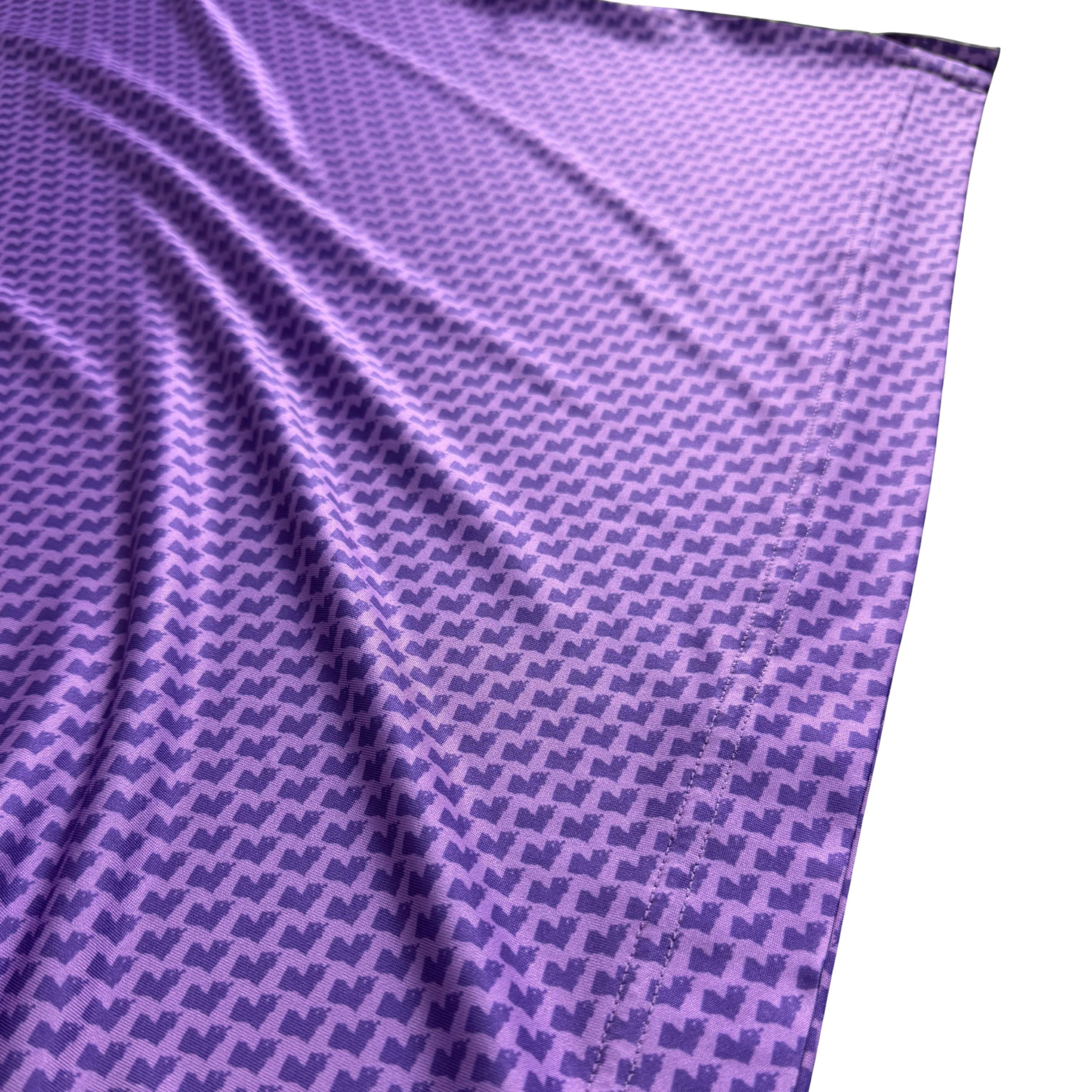 Purple fabric with a geometric pattern on a white background