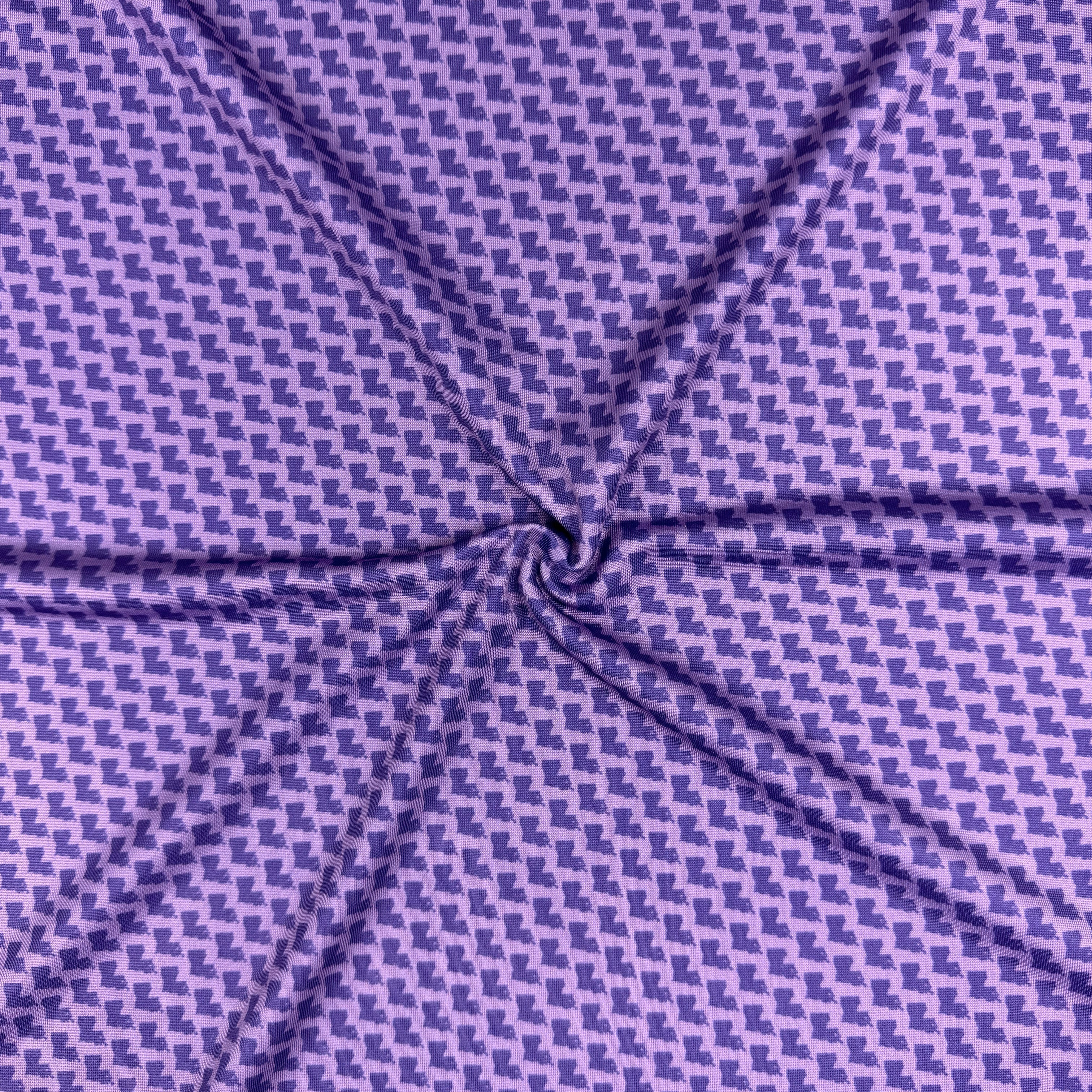 Close-up of purple fabric with a subtle pattern