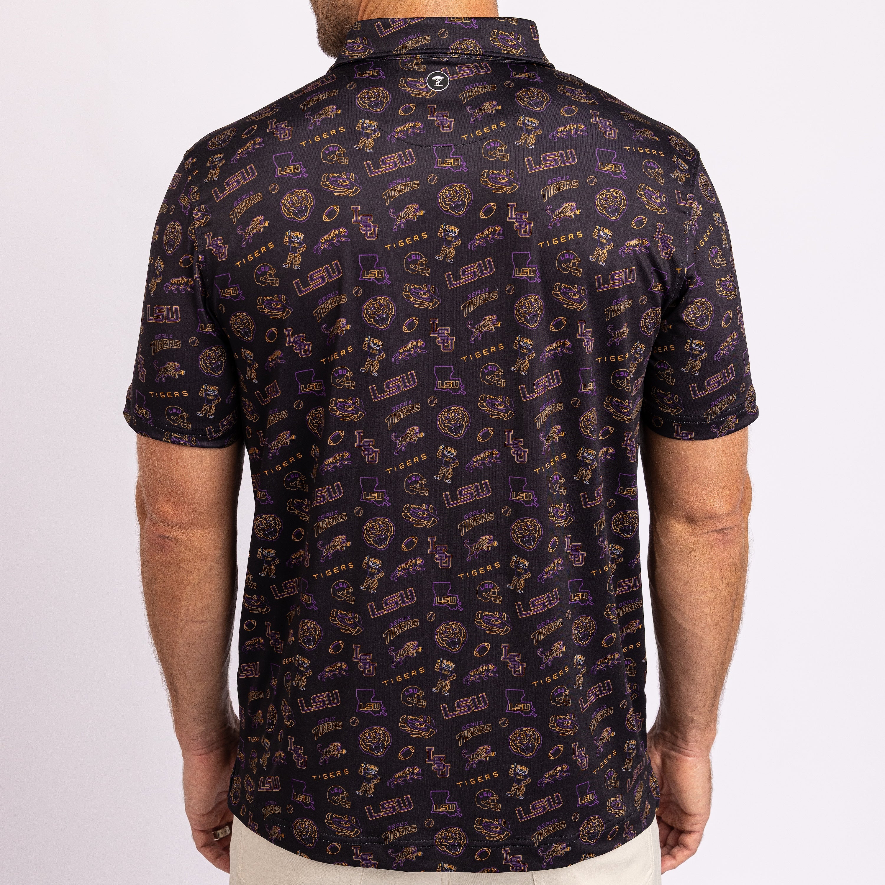 A man wearing a short-sleeve polo shirt from the back, featuring an all-over repeating pattern of purple and gold Louisiana