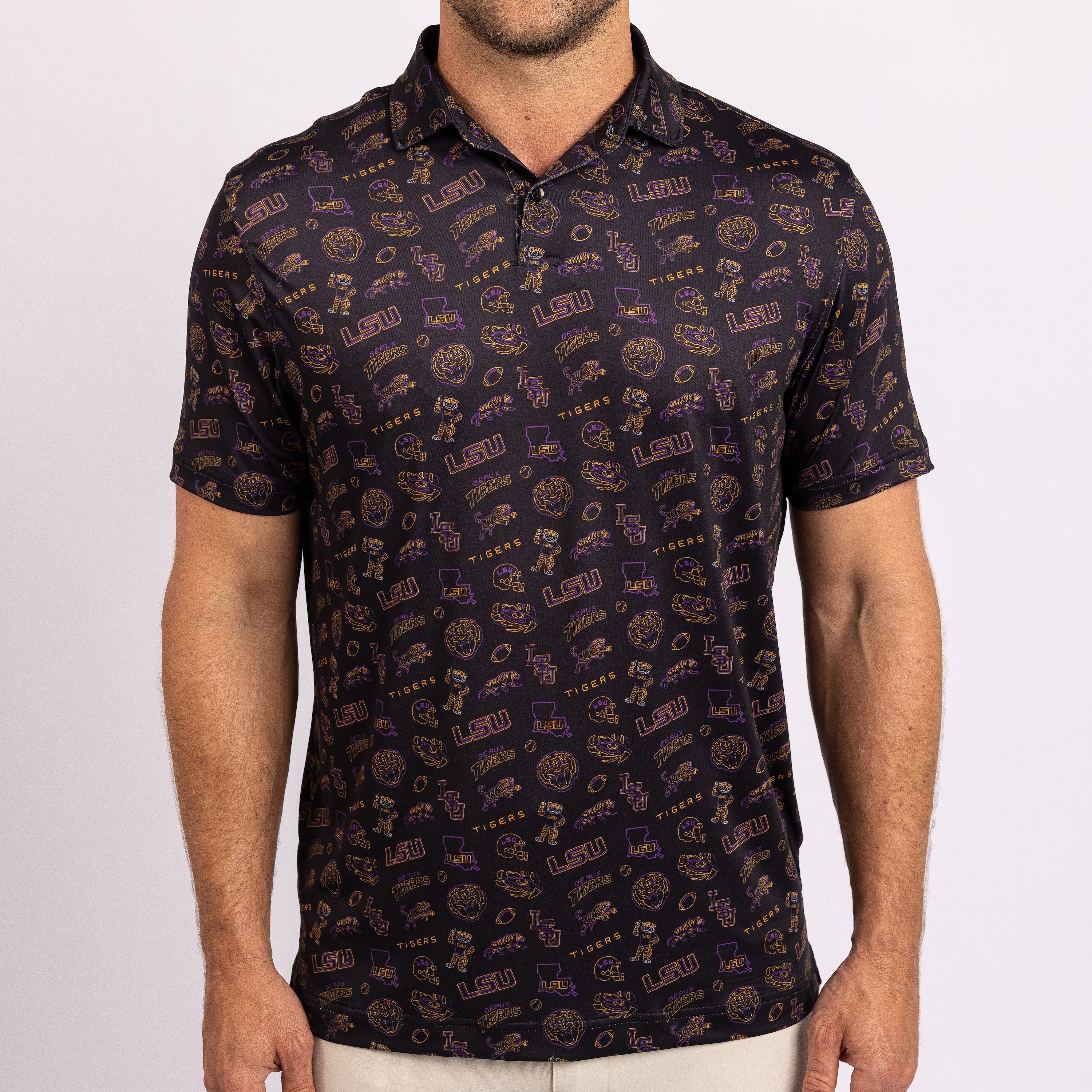 A man wearing a short-sleeve polo shirt with an all-over Louisiana University of Louisiana themed print in purple, gold, and black, shown from the neck down against a light gray background.