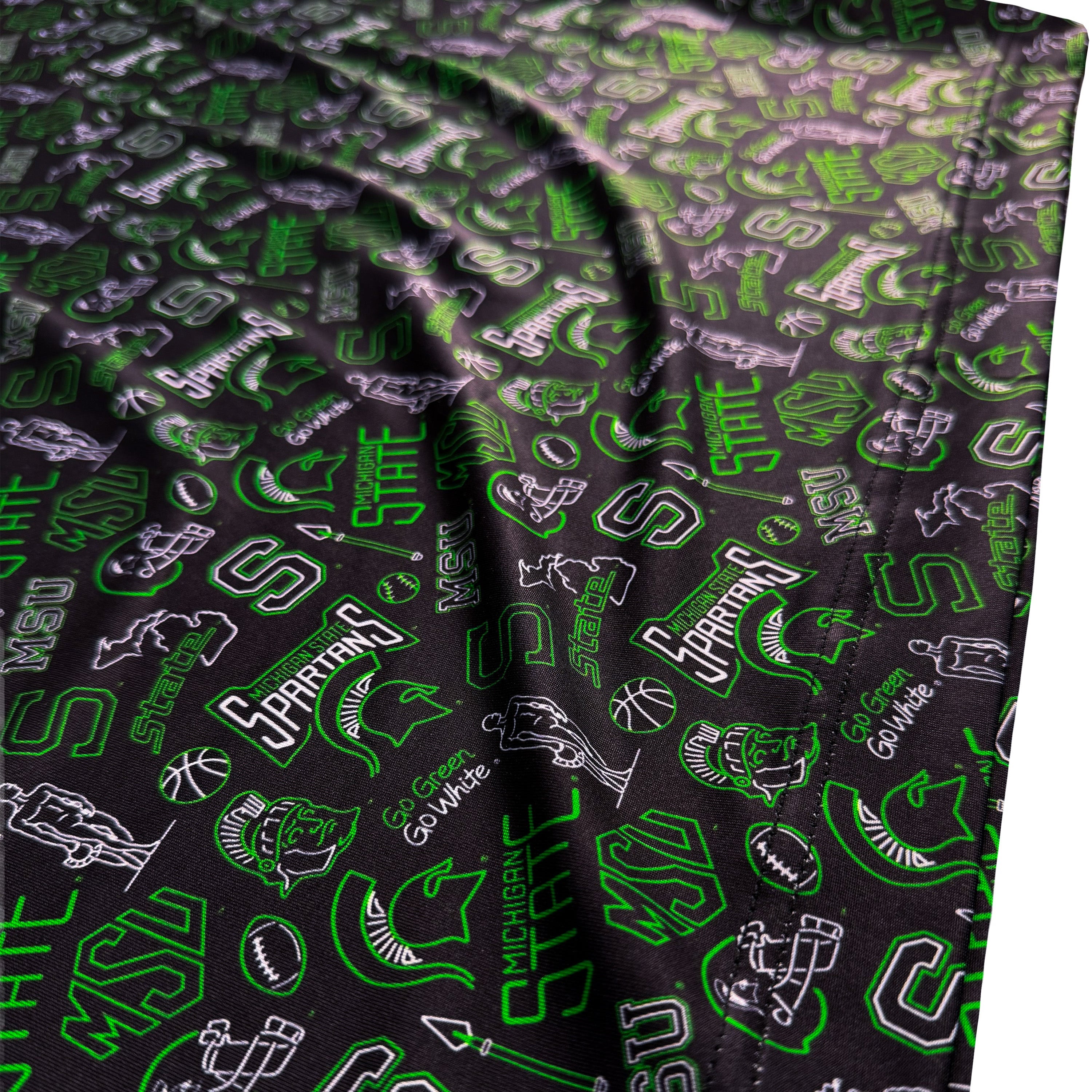 Green and black patterned fabric with logos and text