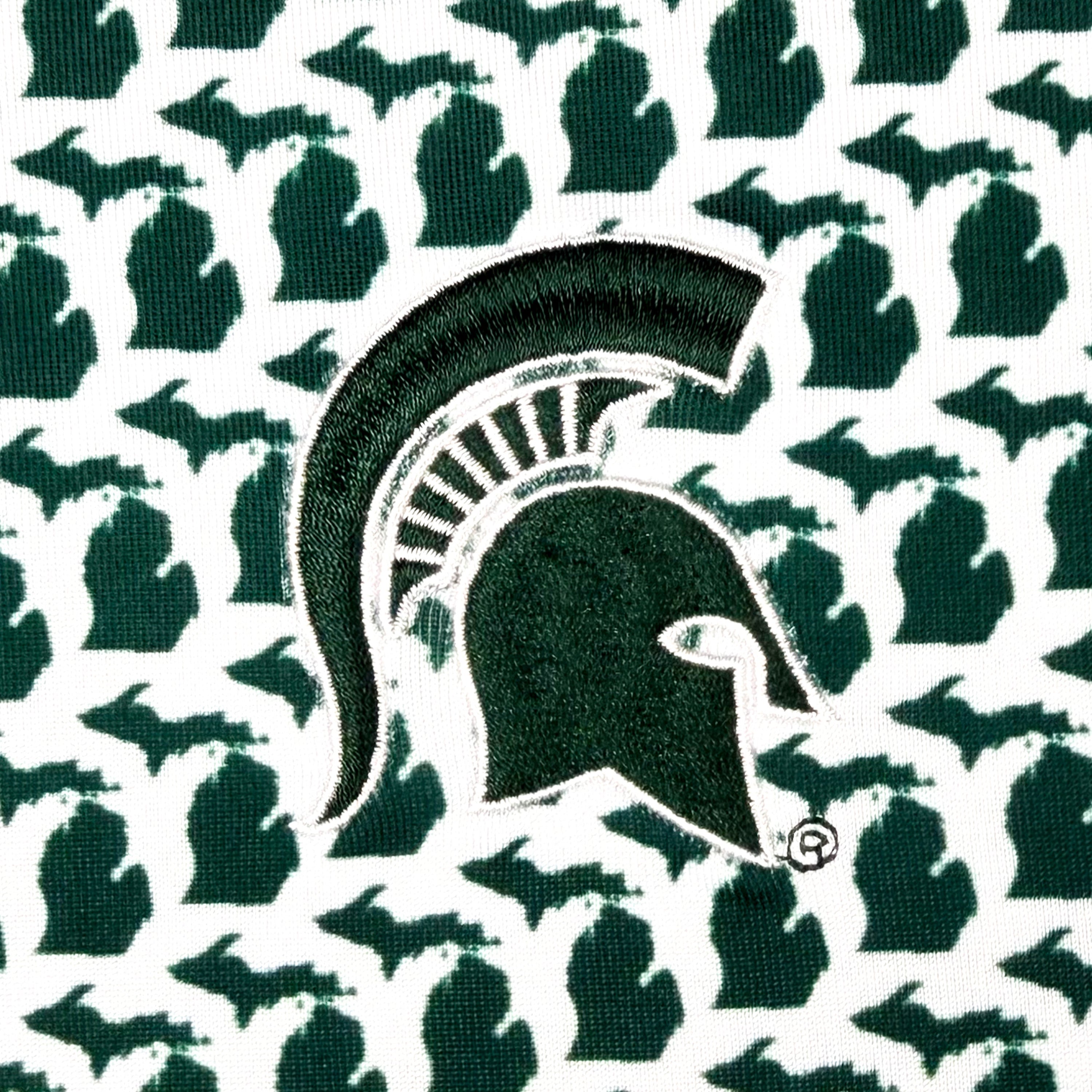 Logo of MSU green and white polo