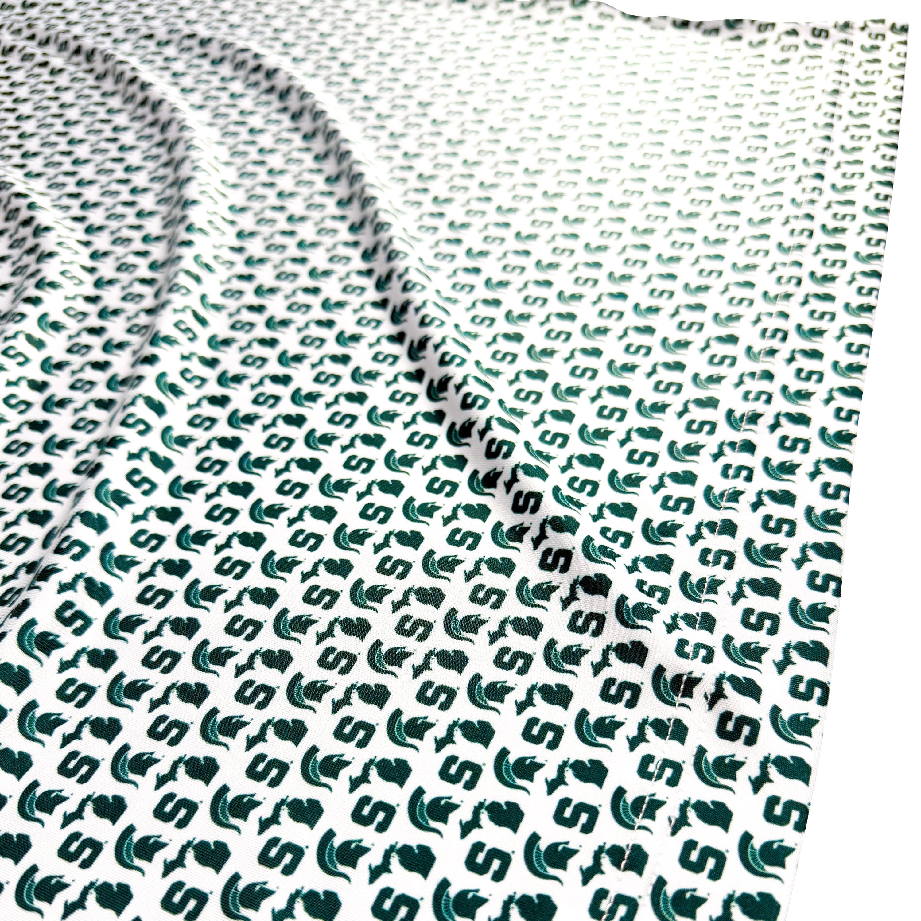Textured green and white fabric with a pattern