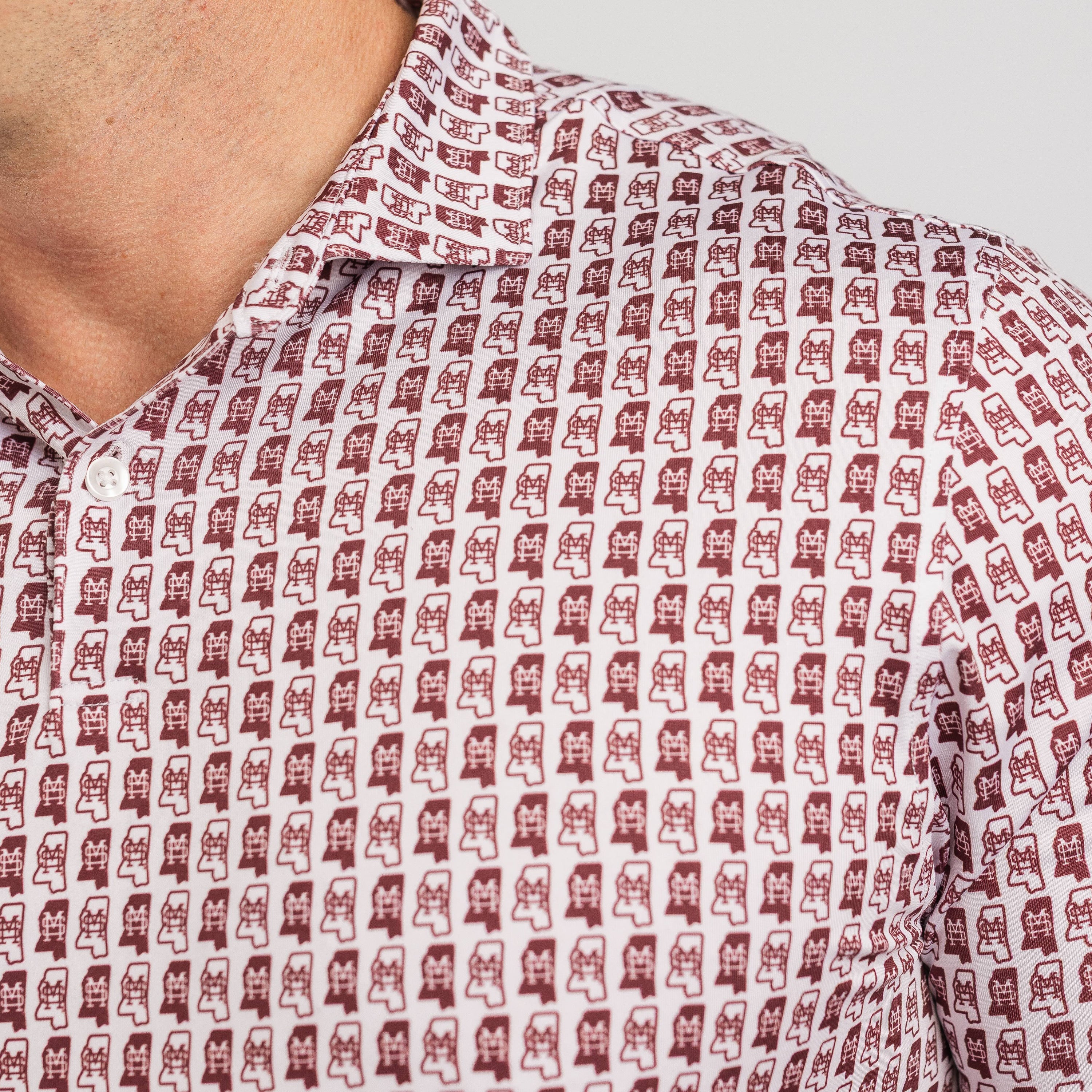 Close-up of a patterned shirt with small icons on a plain background