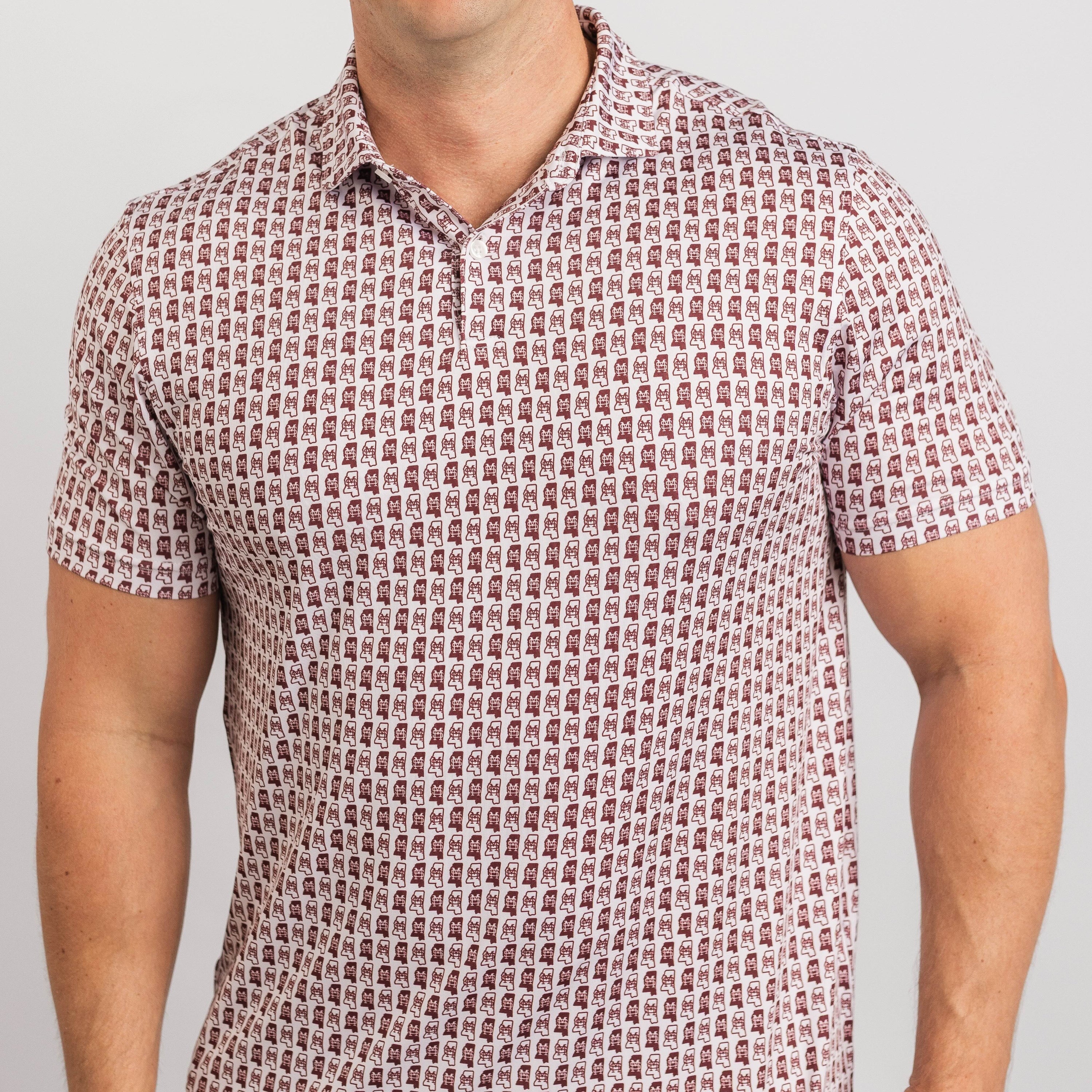 Man wearing a patterned short-sleeve shirt against a plain background