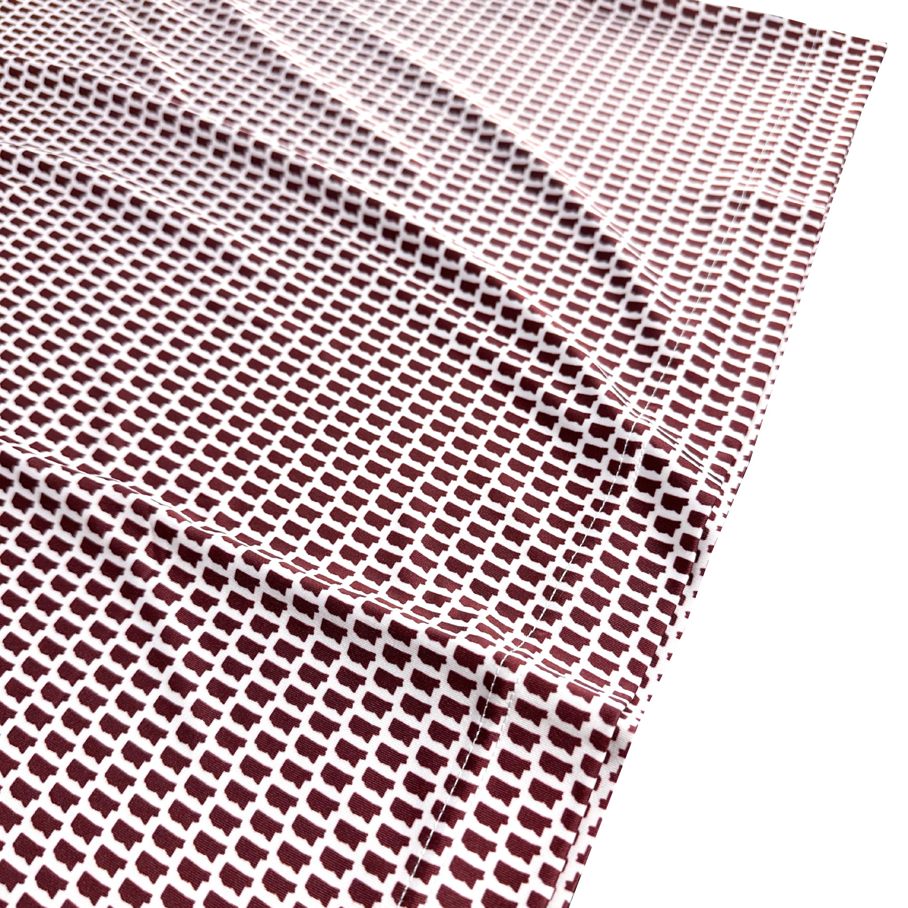 Close-up of a textured red and white fabric with a grid pattern