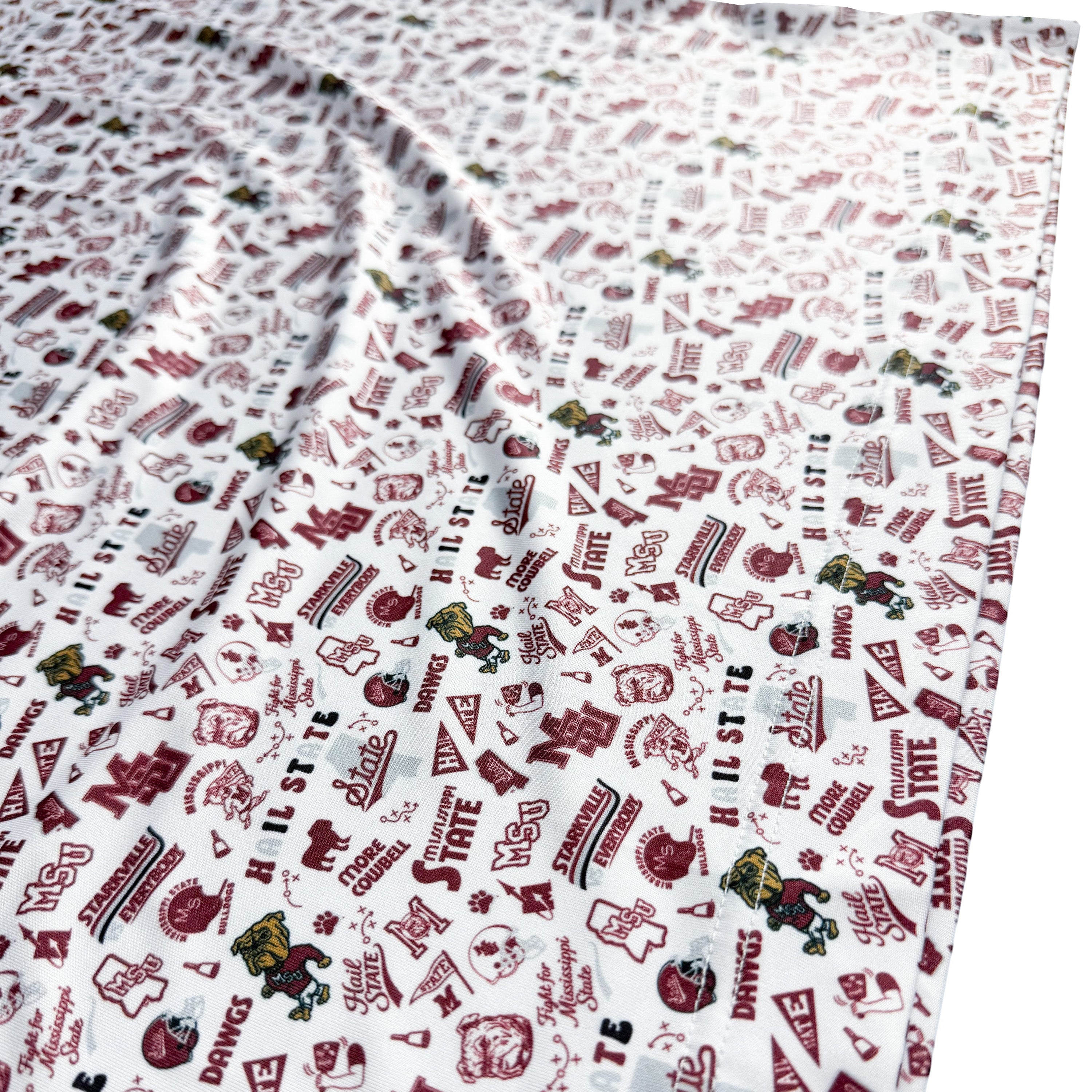 Patterned fabric with red and black designs on a white background