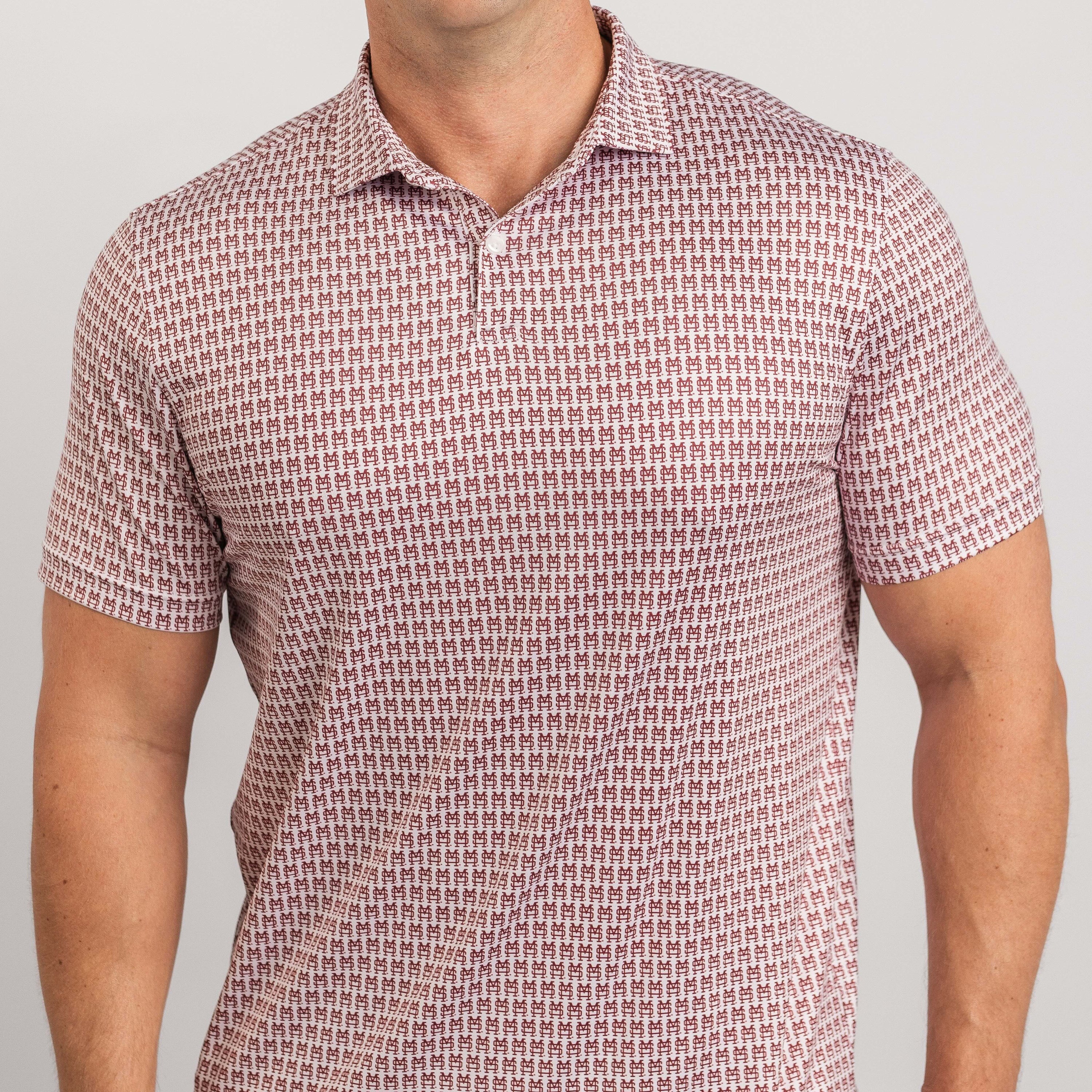 Man wearing a patterned red and white polo shirt against a plain background