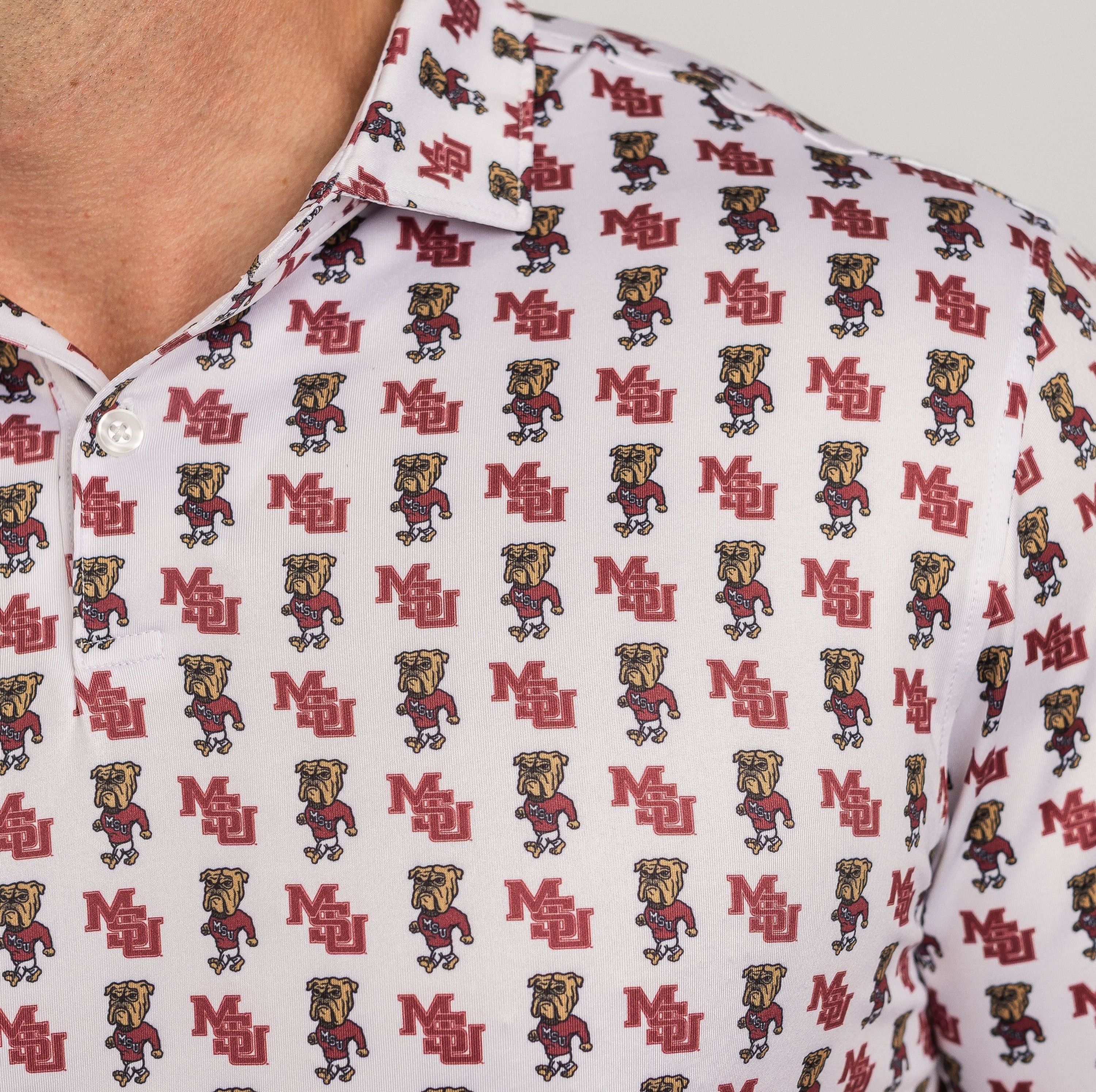 Close-up of a white shirt with red and black logo pattern