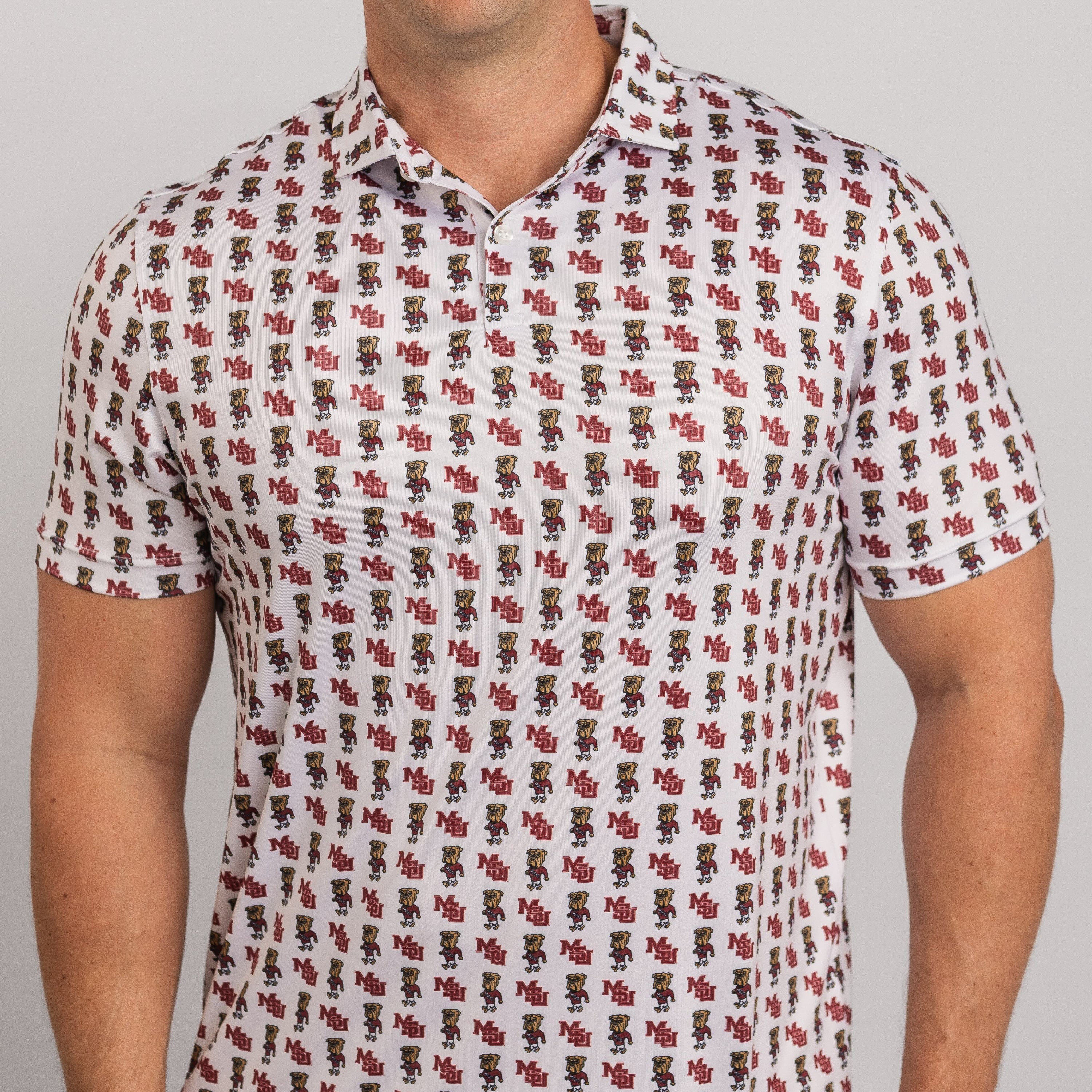 Person wearing a patterned shirt with small figures on a plain background