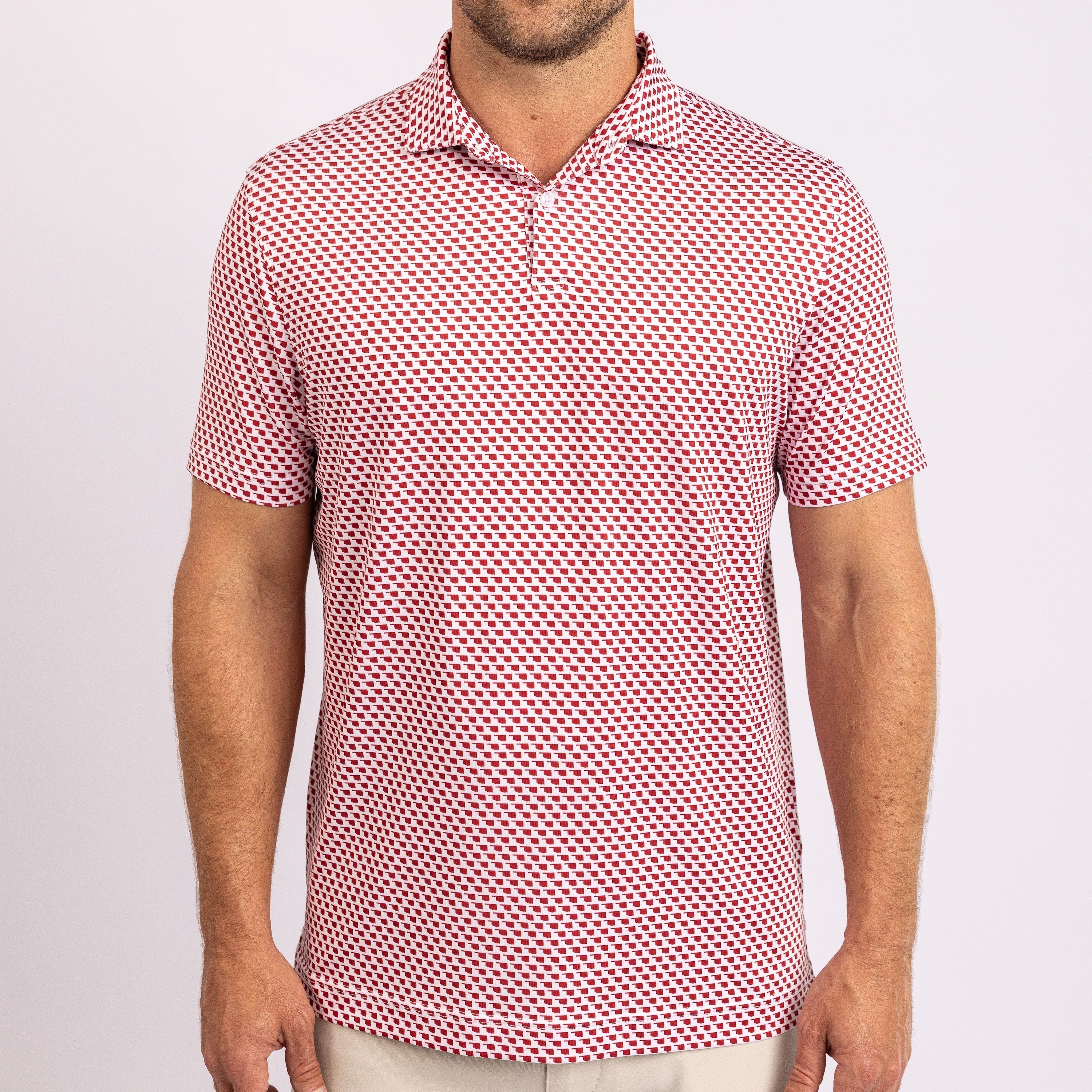 A red and white geometric patterned men's polo shirt with a collar.