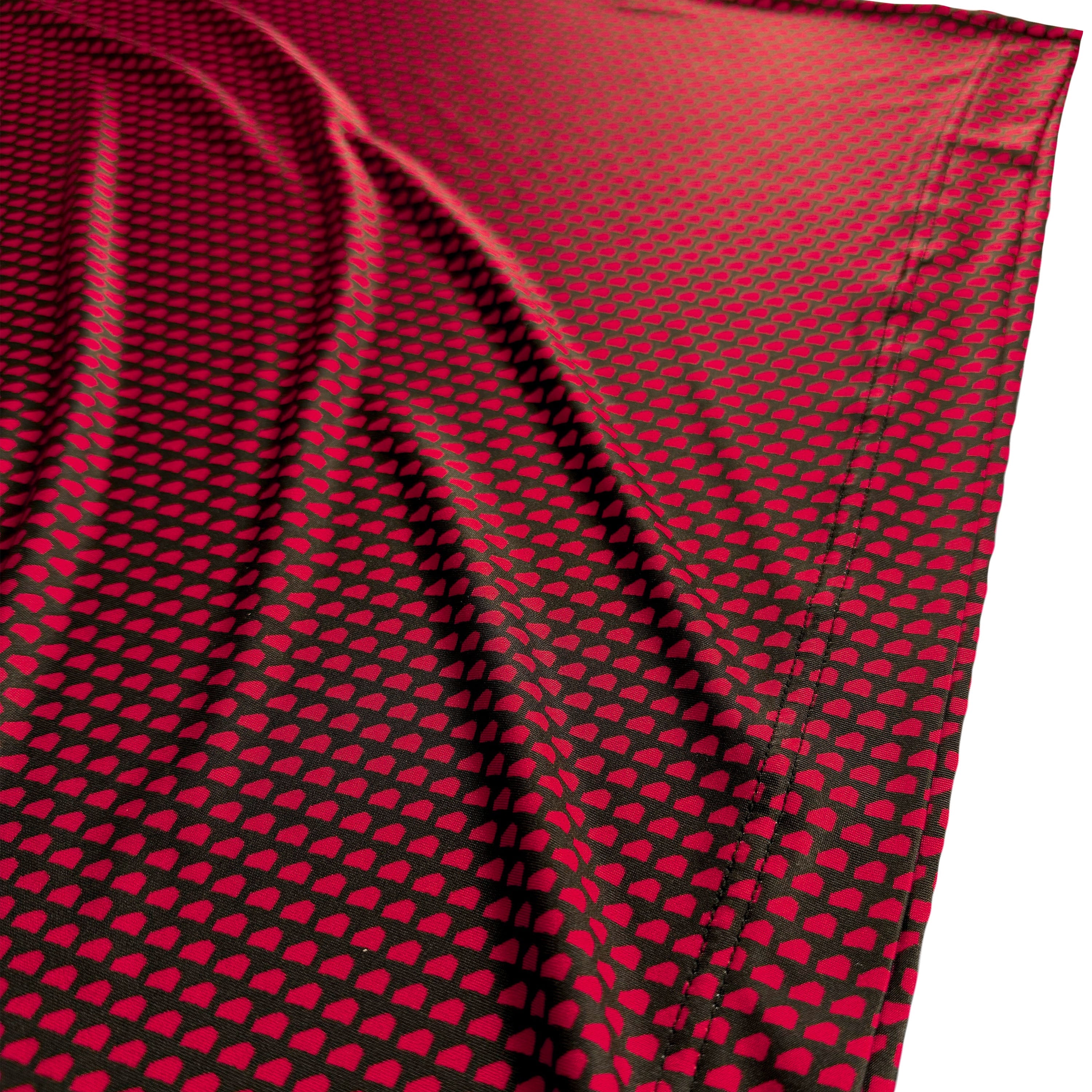 Red fabric with black heart pattern