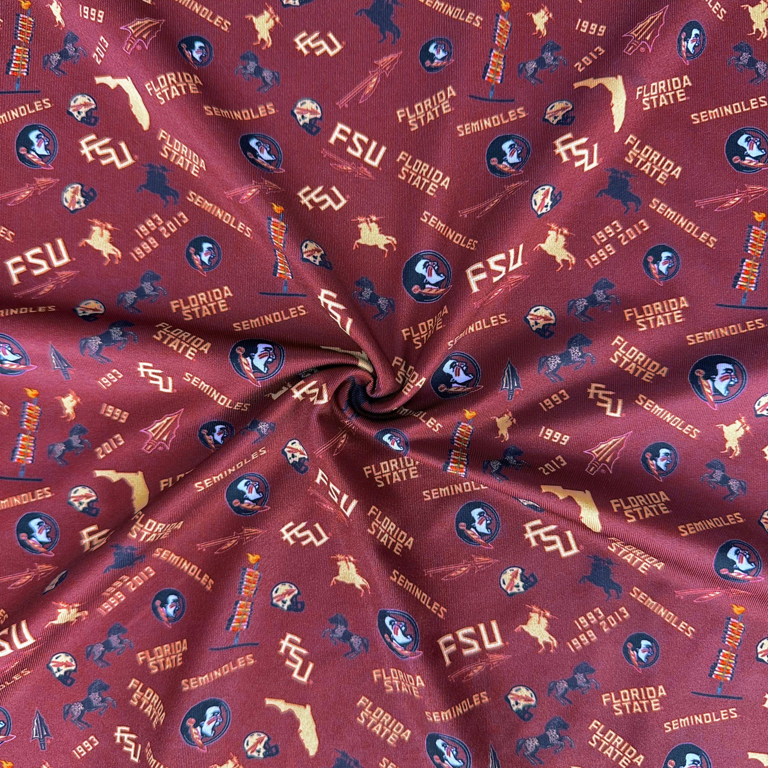 Fabric with Florida State University logos and text on a red background