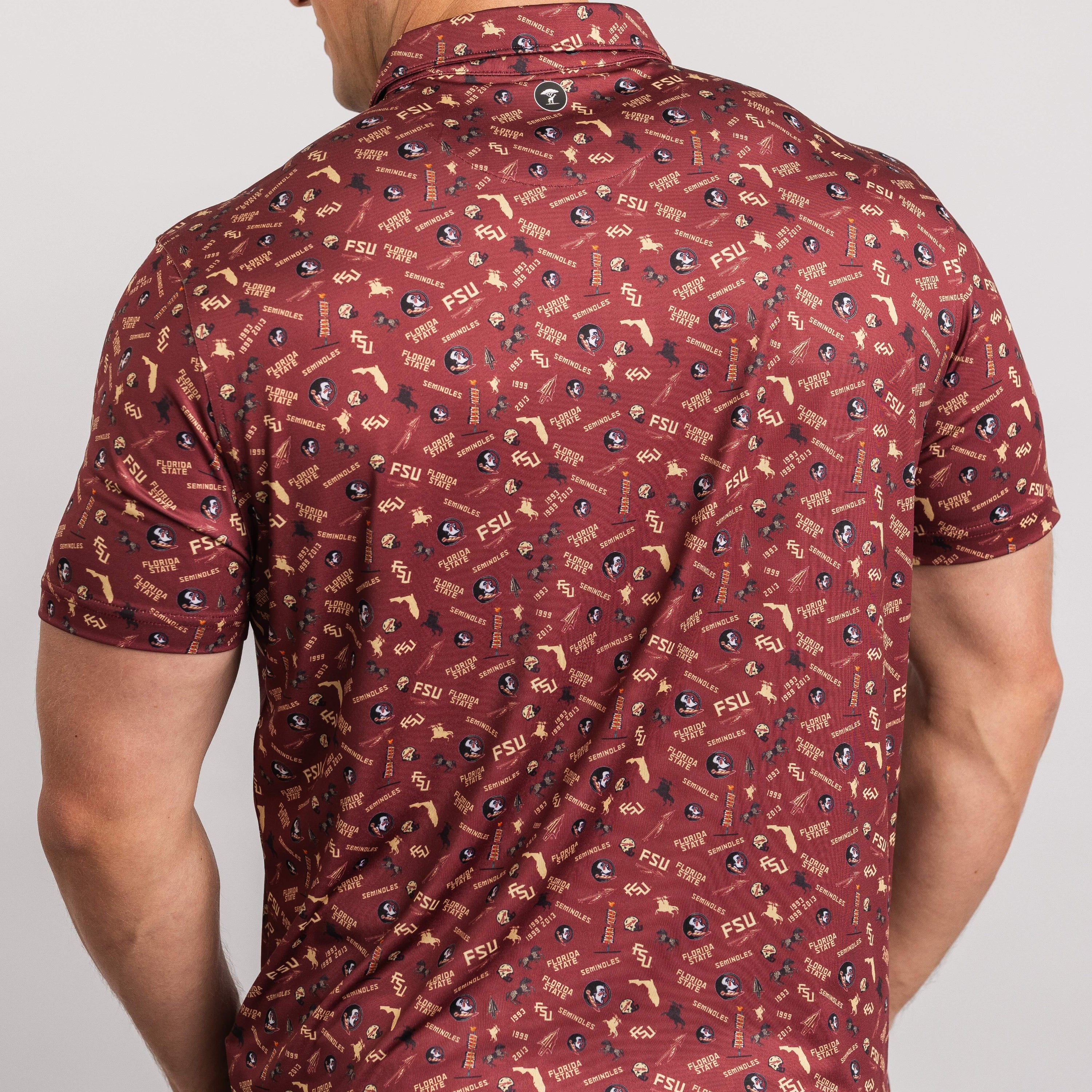 Man wearing a patterned red shirt on a plain background