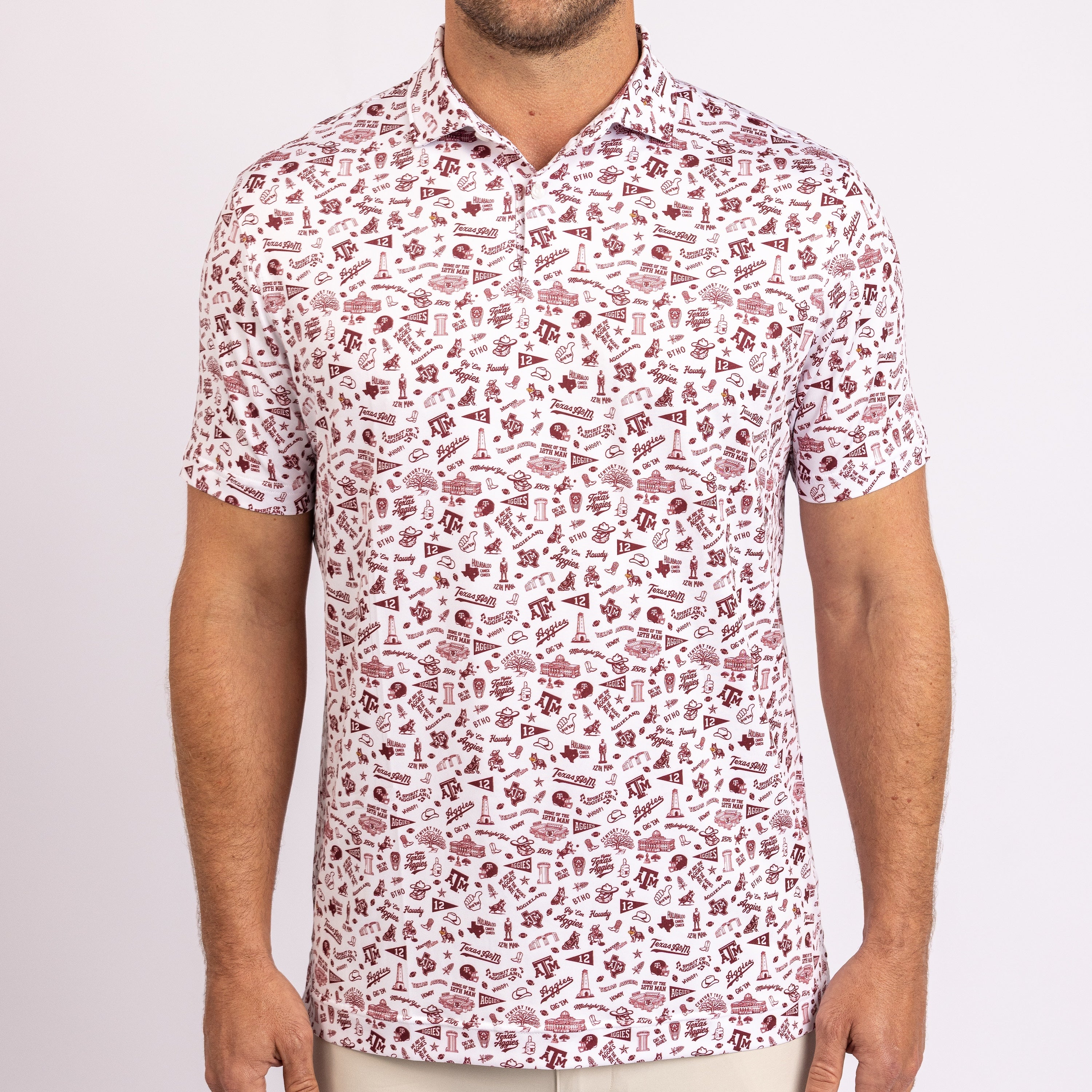A man wearing a short-sleeve button-up polo shirt with an all-over maroon and white graphic print, shown from the neck down against a light gray background.