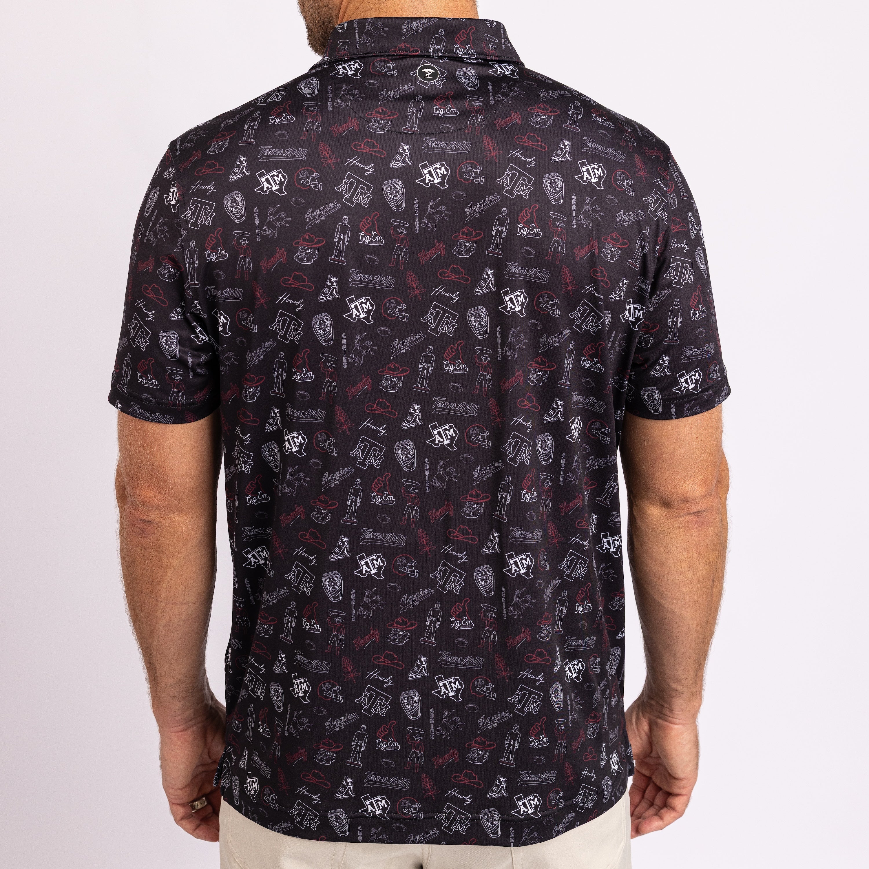 A man wearing a short-sleeve button-up shirt from the back, featuring an all-over graphic print