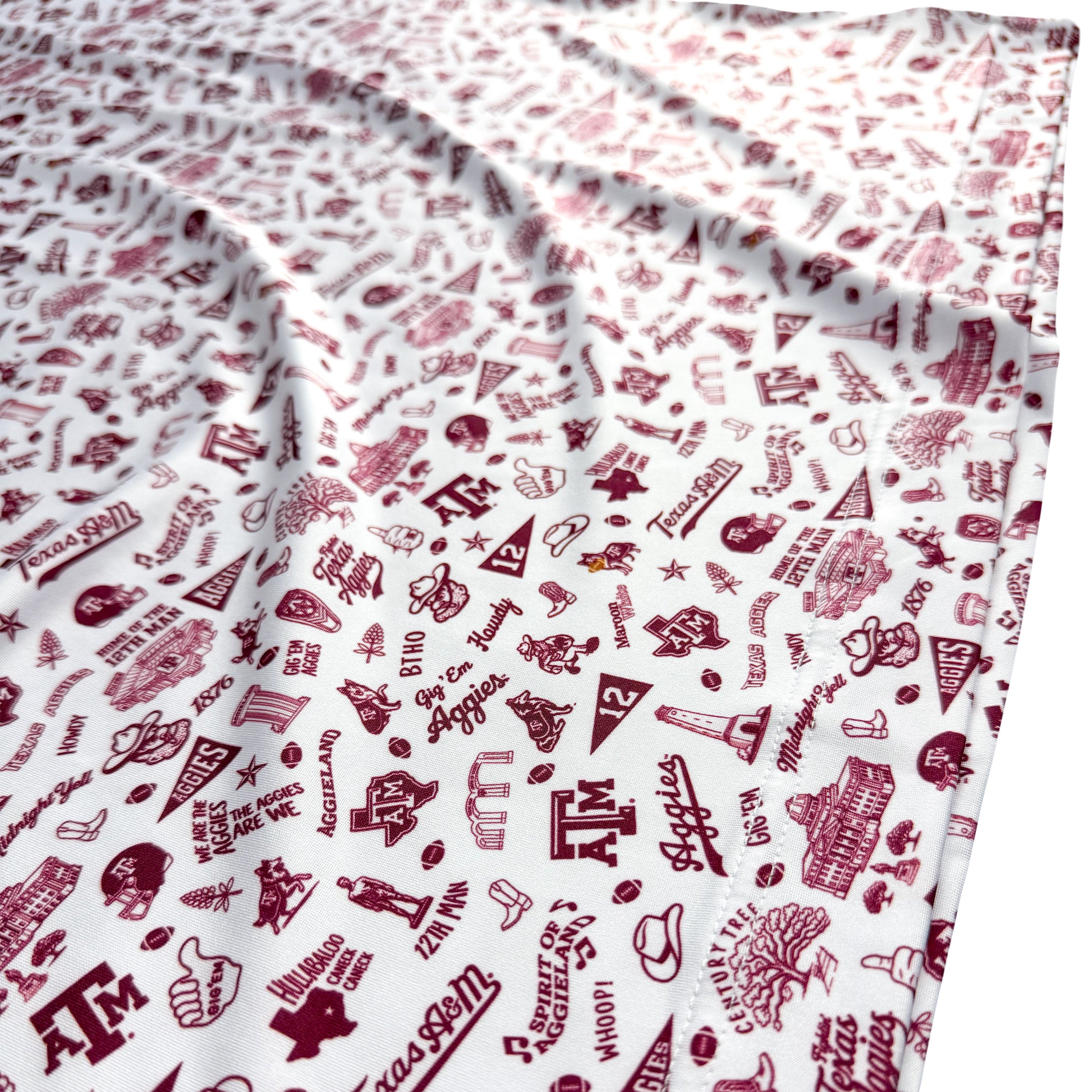 White fabric with red Texas A&M university-themed patterns