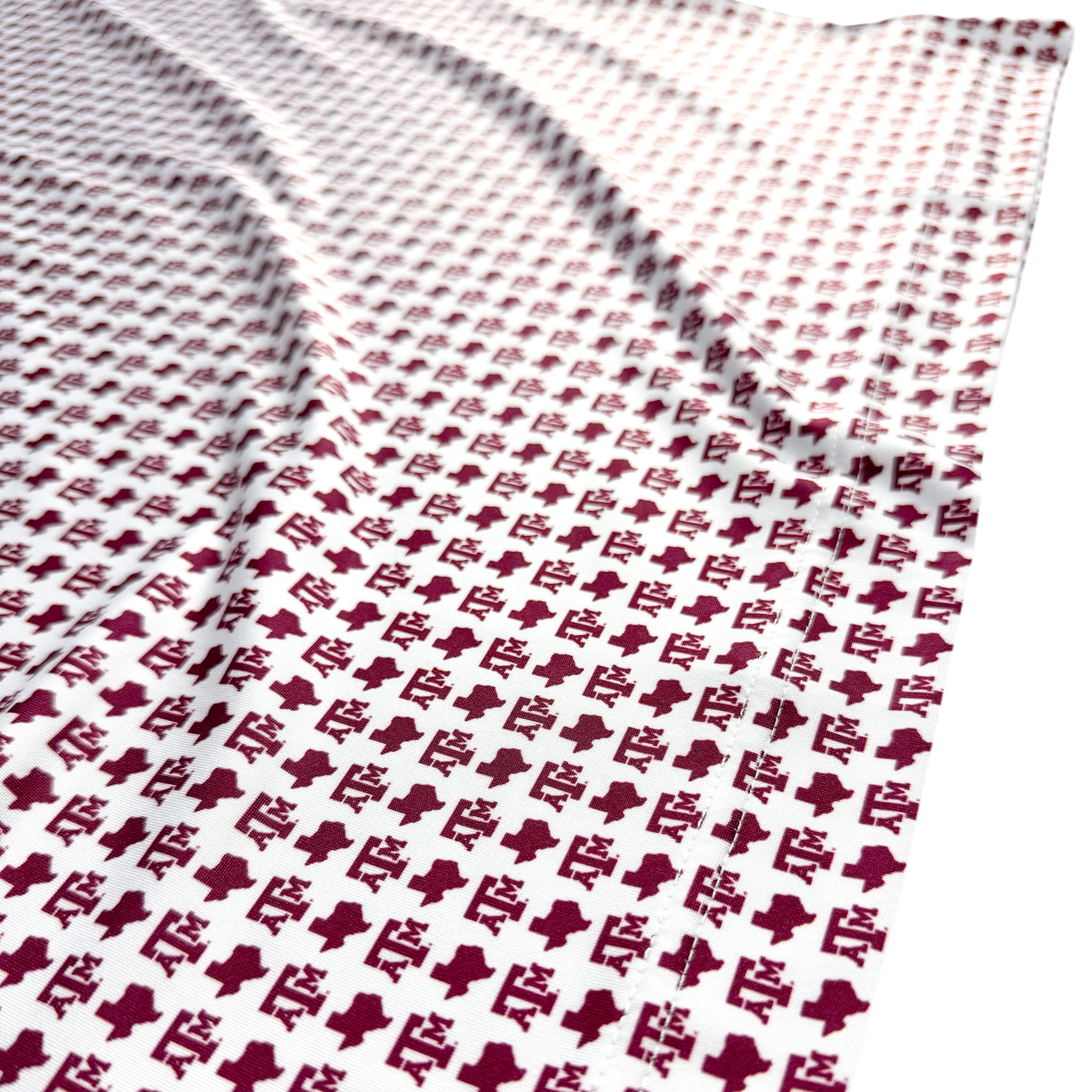 Textured fabric with a pattern of small, raised bumps on a white background
