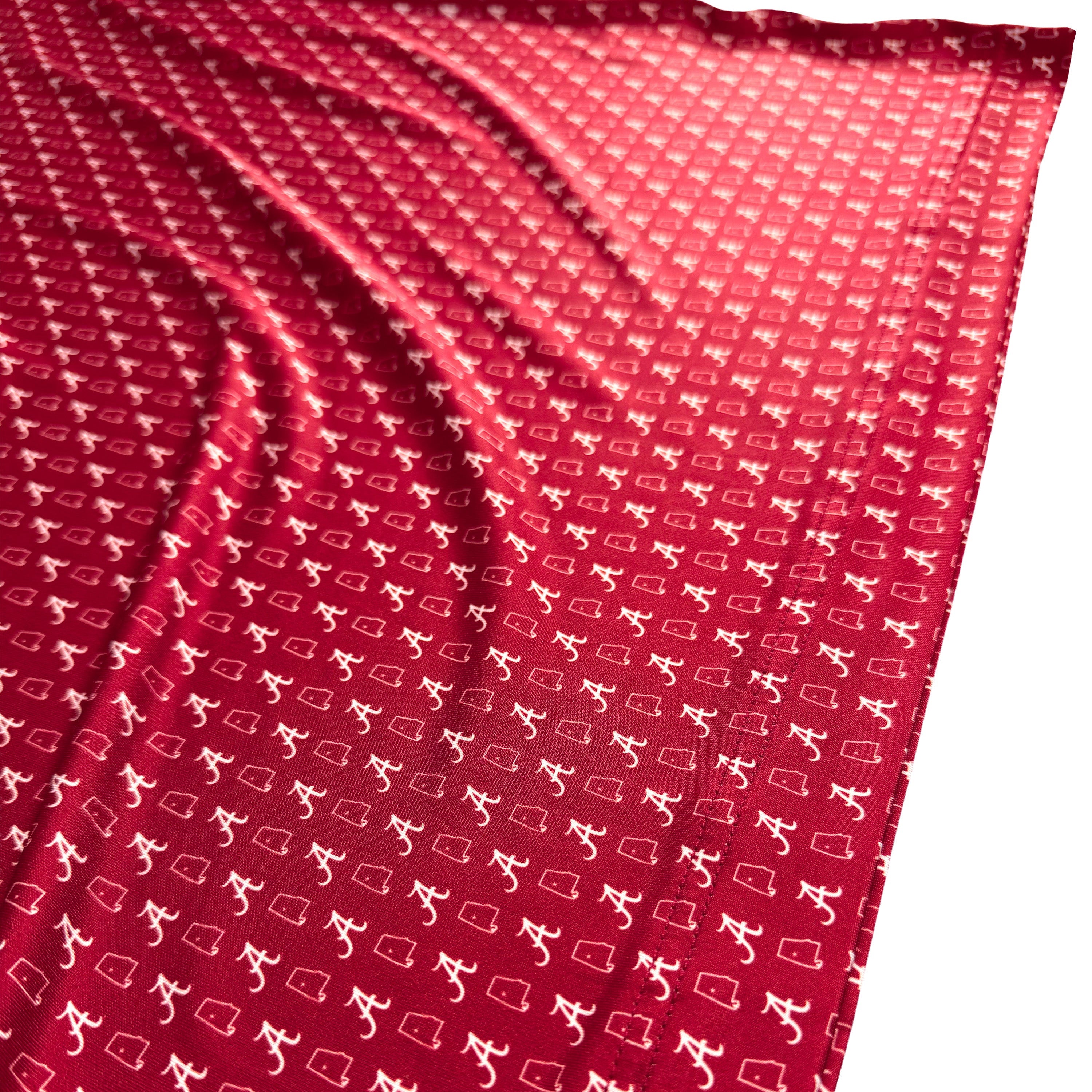 Red fabric with white geometric pattern on a white background