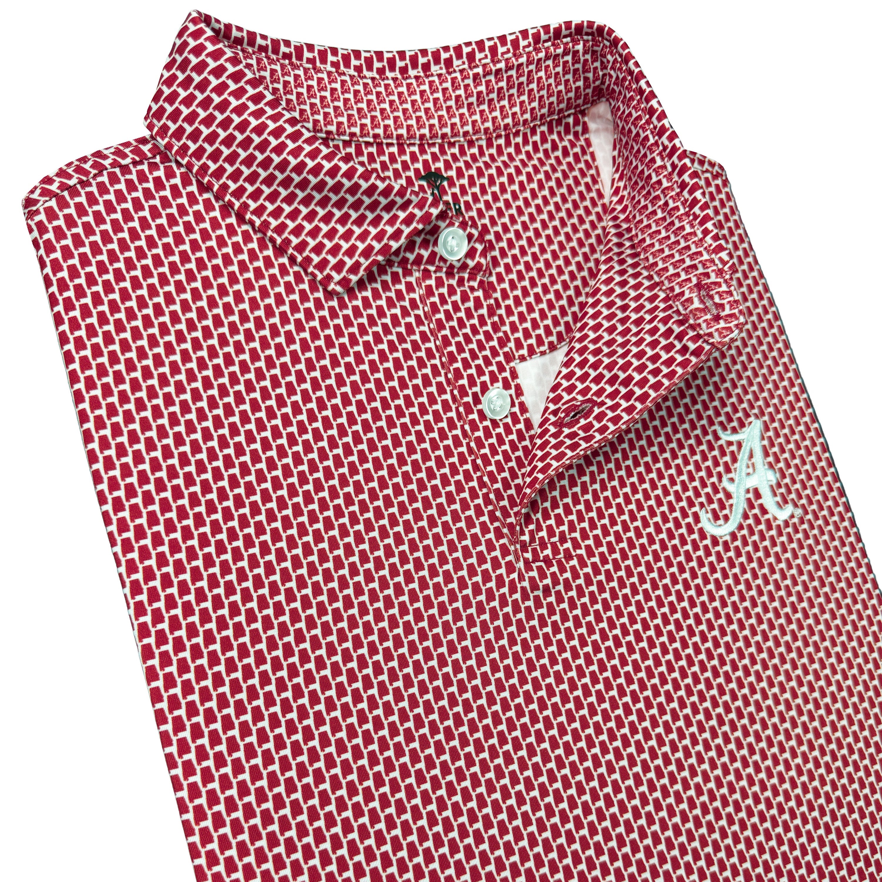 Folded red and white patterned polo shirt with logo on a white background