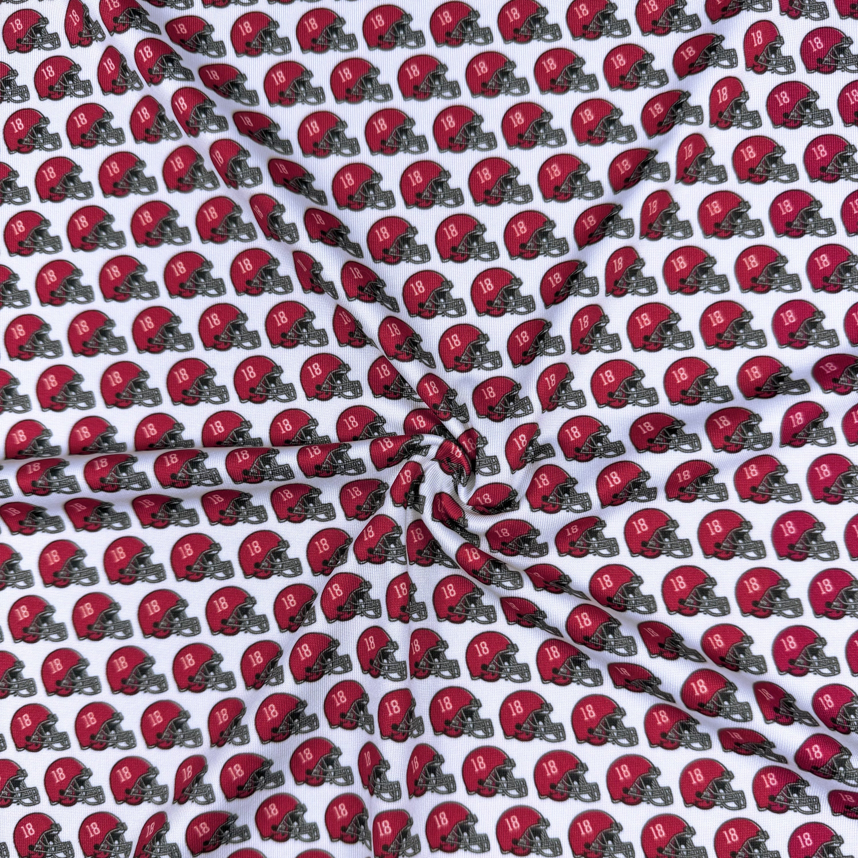 Pattern of red football helmets with number 18 on a white background