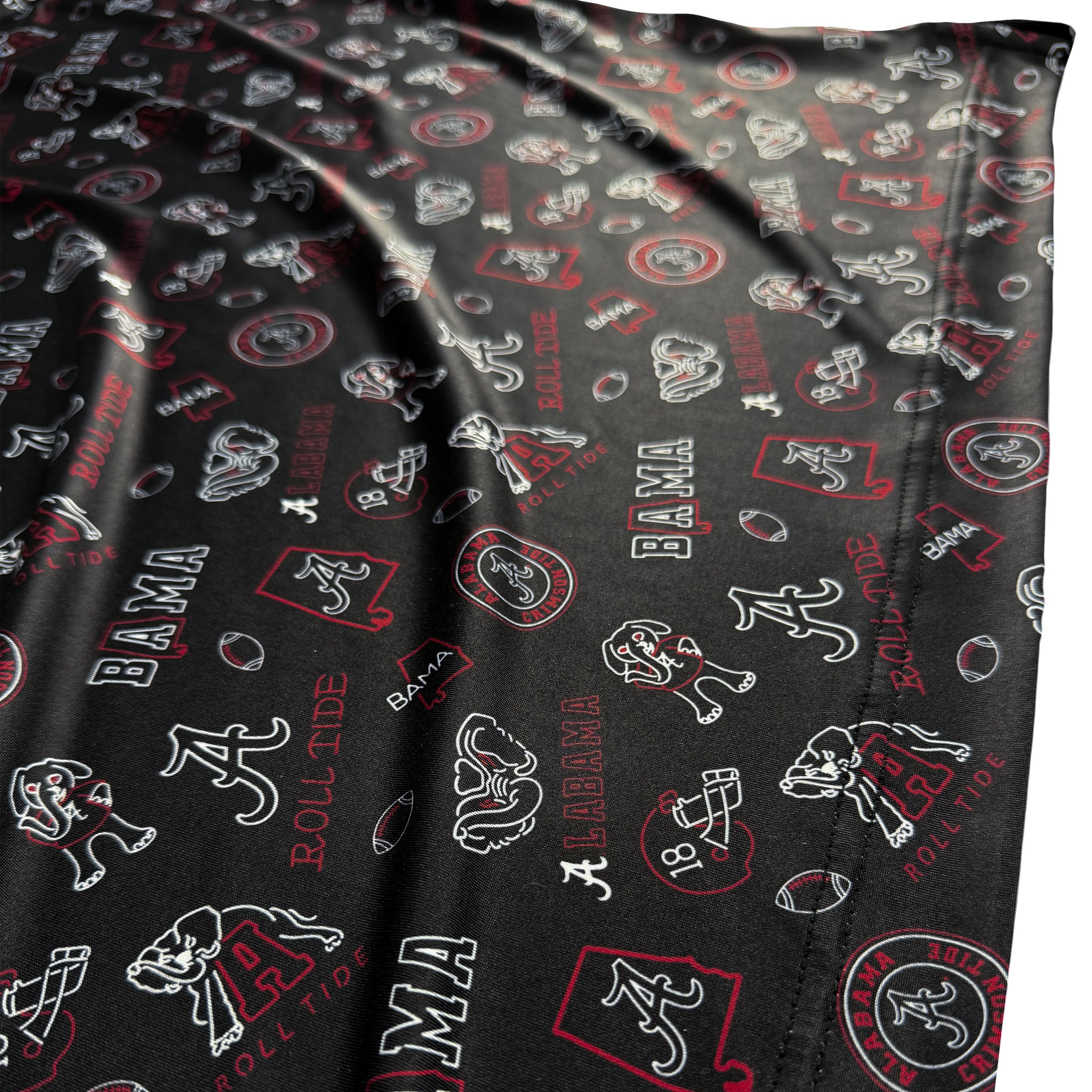 Black fabric with red, white, and gray logos and text patterns