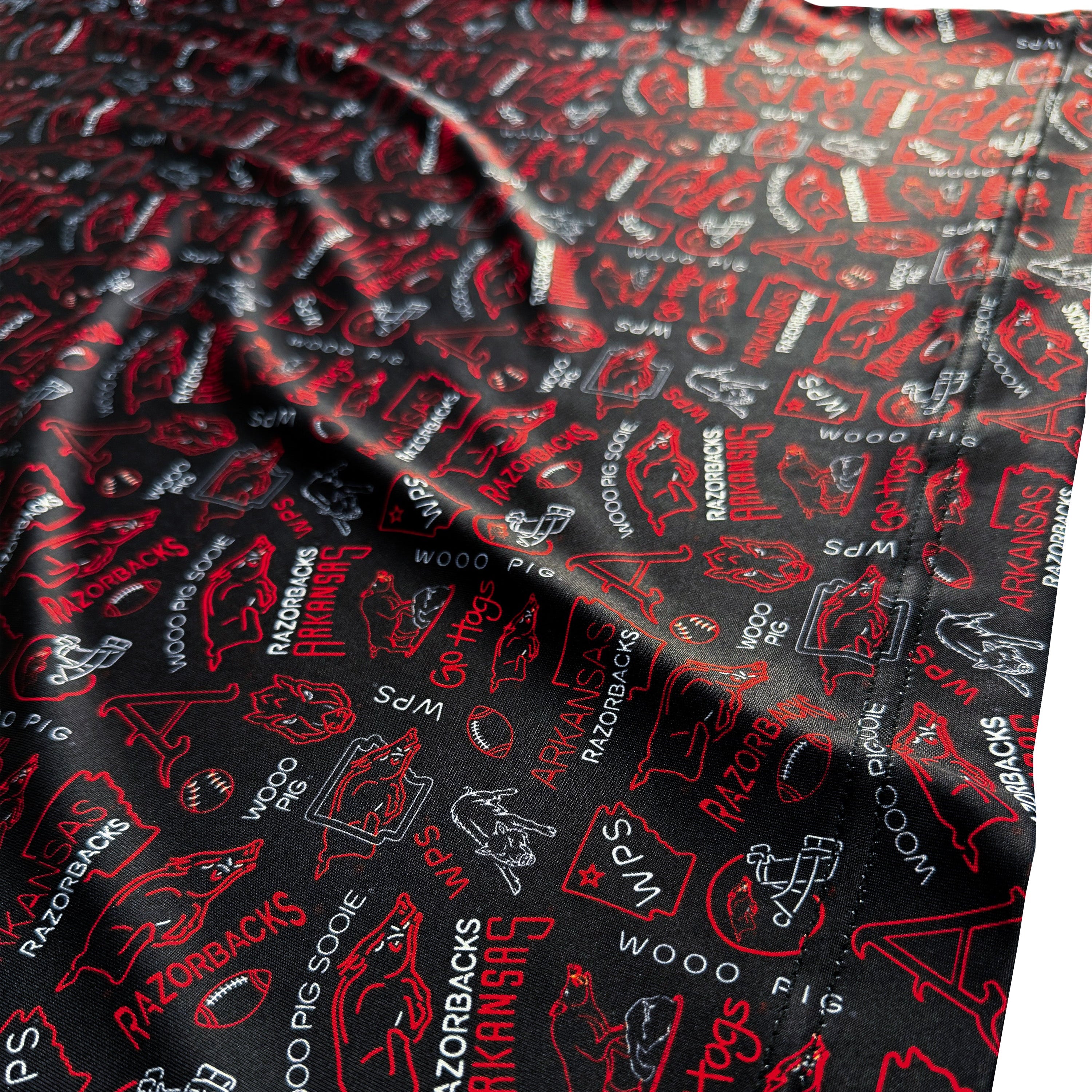 Black fabric with red and white logos and text, including 'Razorbacks' and 'Arkansas'.