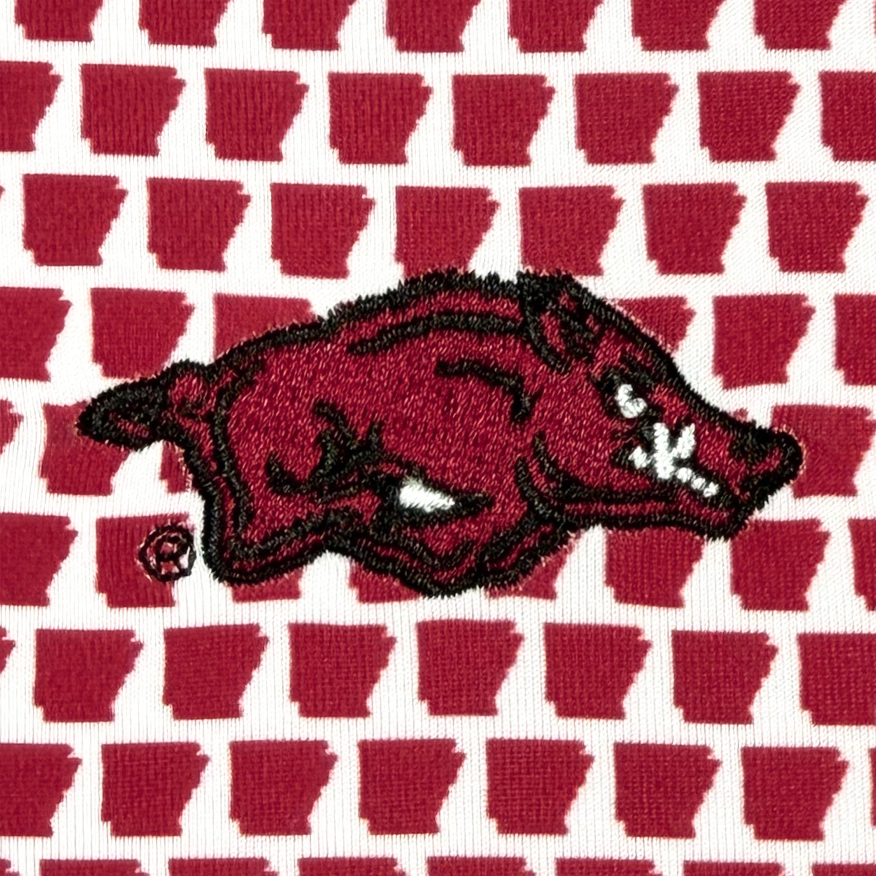 Red and black logo on a patterned background