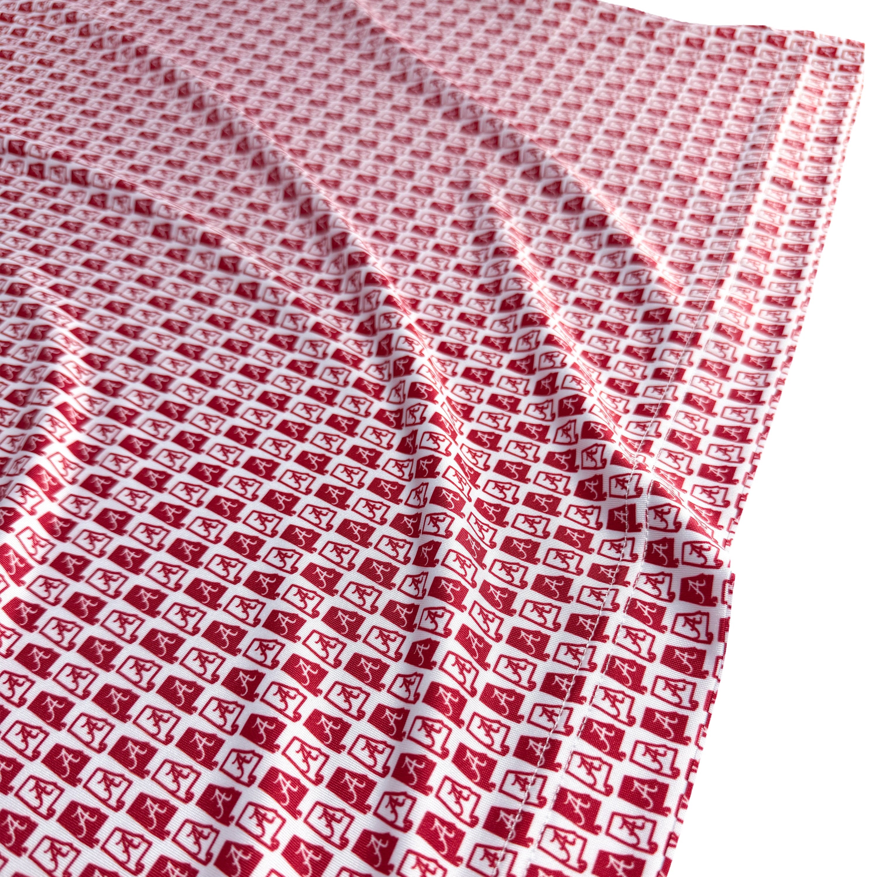 Red and white checkered fabric with a pattern of small squares.